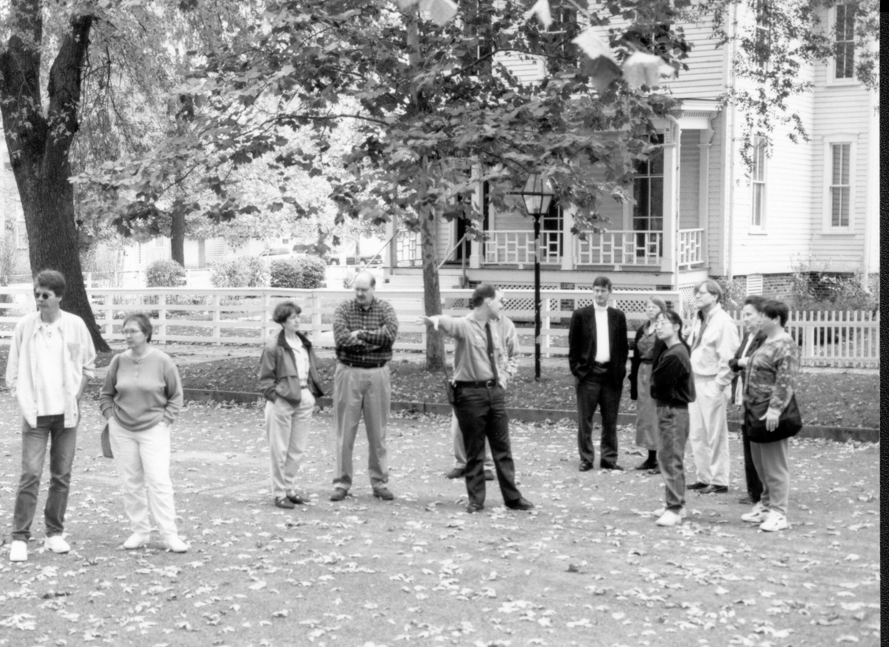 Visitors standing in street with Ranger. Lincoln Colloquium; UIS Roll#1, 1of4 Lincoln, Colloquium