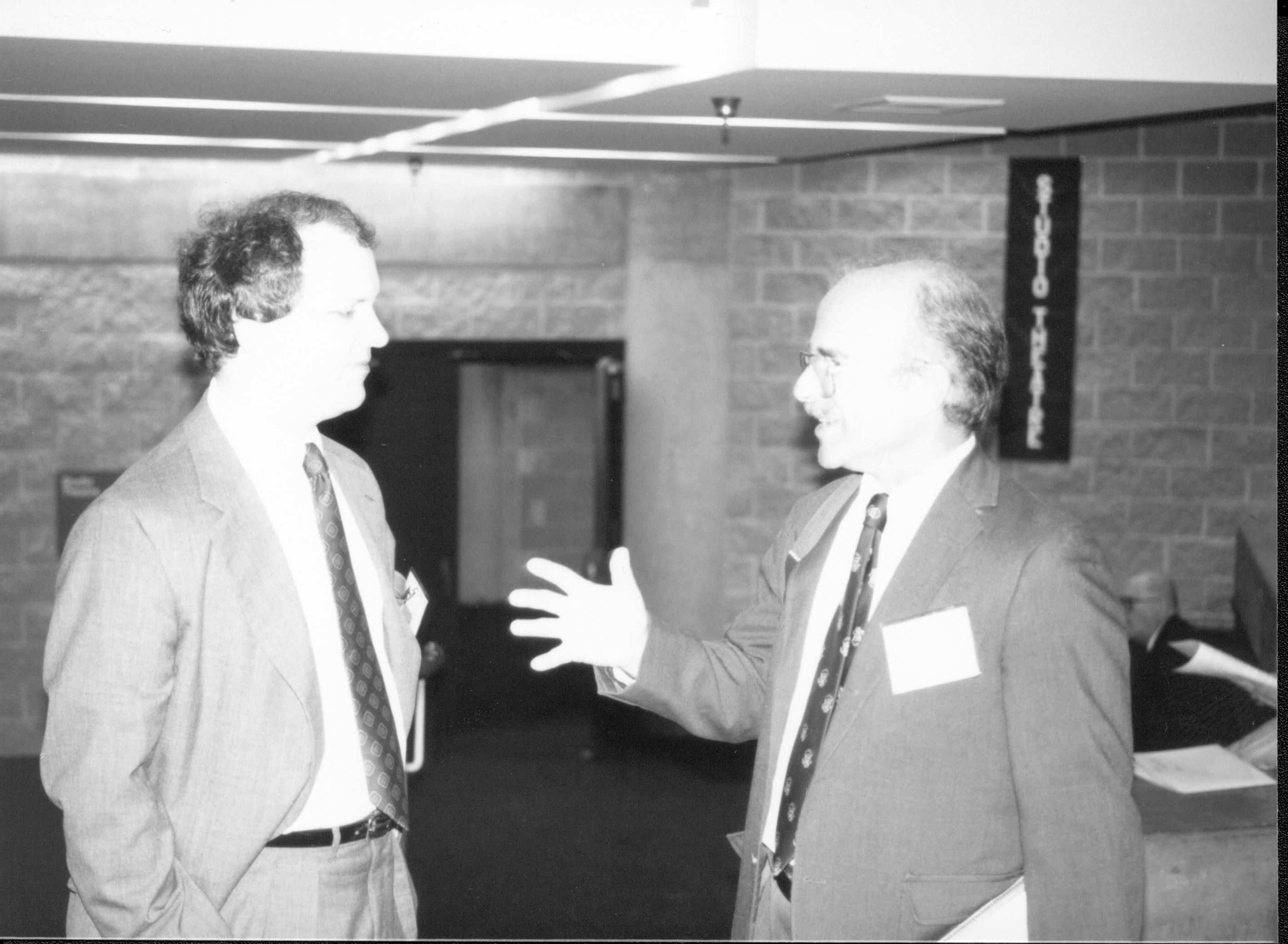 Two men talking, one jesturing. Lincoln Colloquium; UIS Roll#2, 1of4 Lincoln, Colloquium