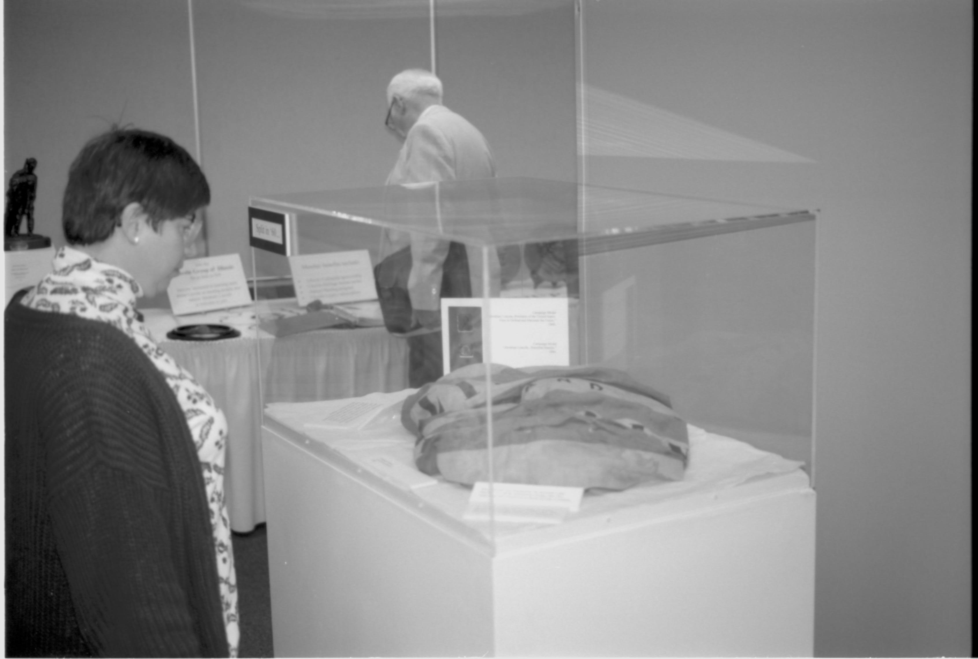 Lady looking at exhibit. Lincoln Colloquium; UIS Roll#2, 4of4 Lincoln, Colloquium