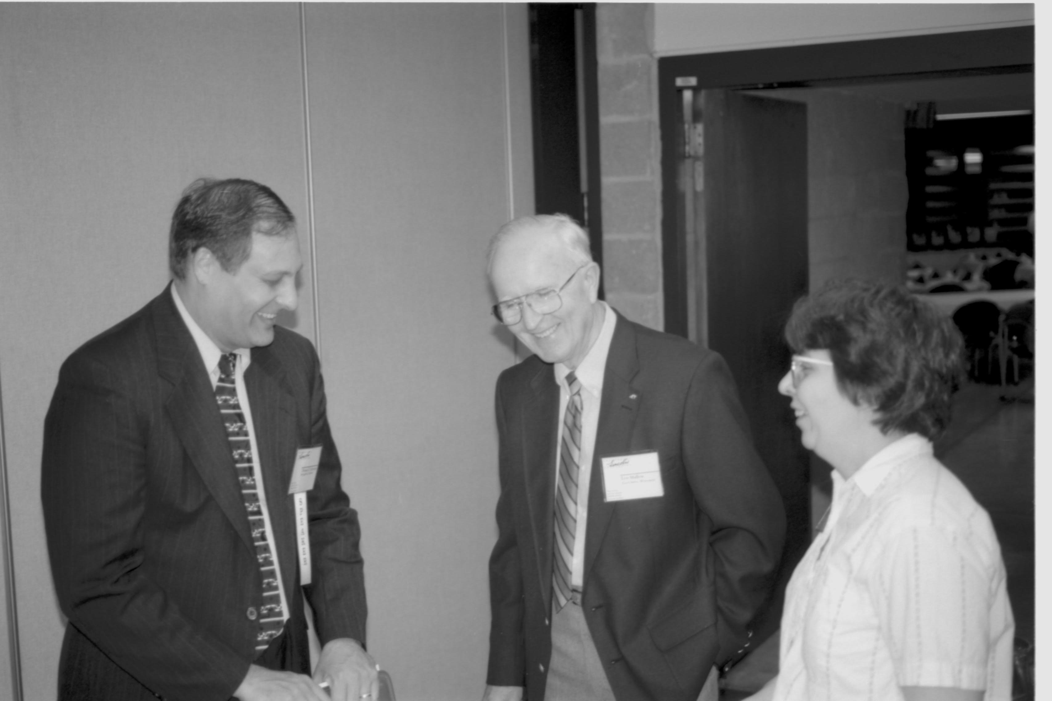 Woman and two men talking. Lincoln Colloquium; UIS Roll#2, 4of4 Lincoln, Colloquium