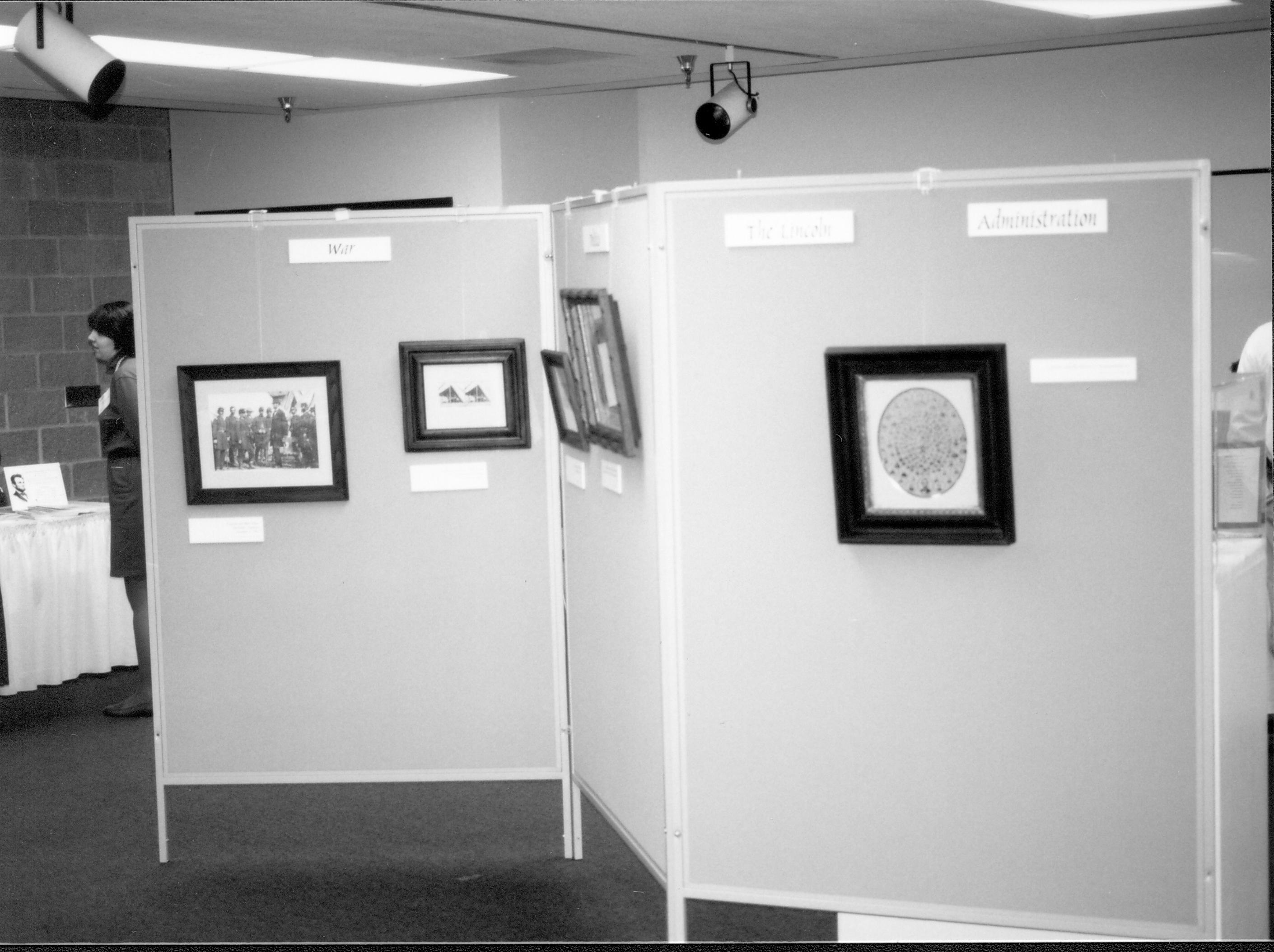 Photographs hanging on display. Lincoln Colloquium; UIS Roll#1, 1of4 Lincoln, Colloquium