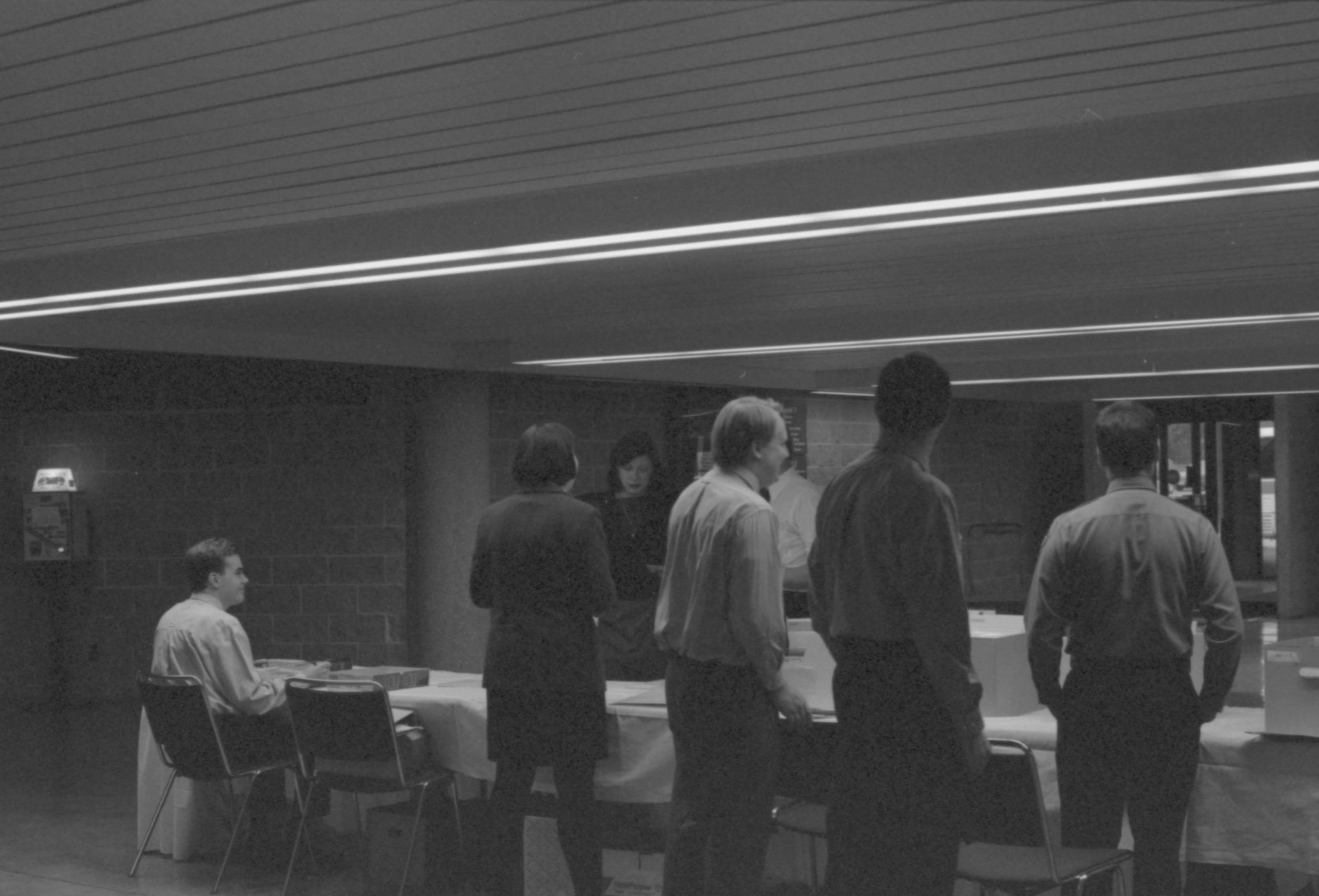 Guest arrival and LIHO-NHS staff @ check-in table. 1-1997 Colloq (b/w) Colloquium, 1997