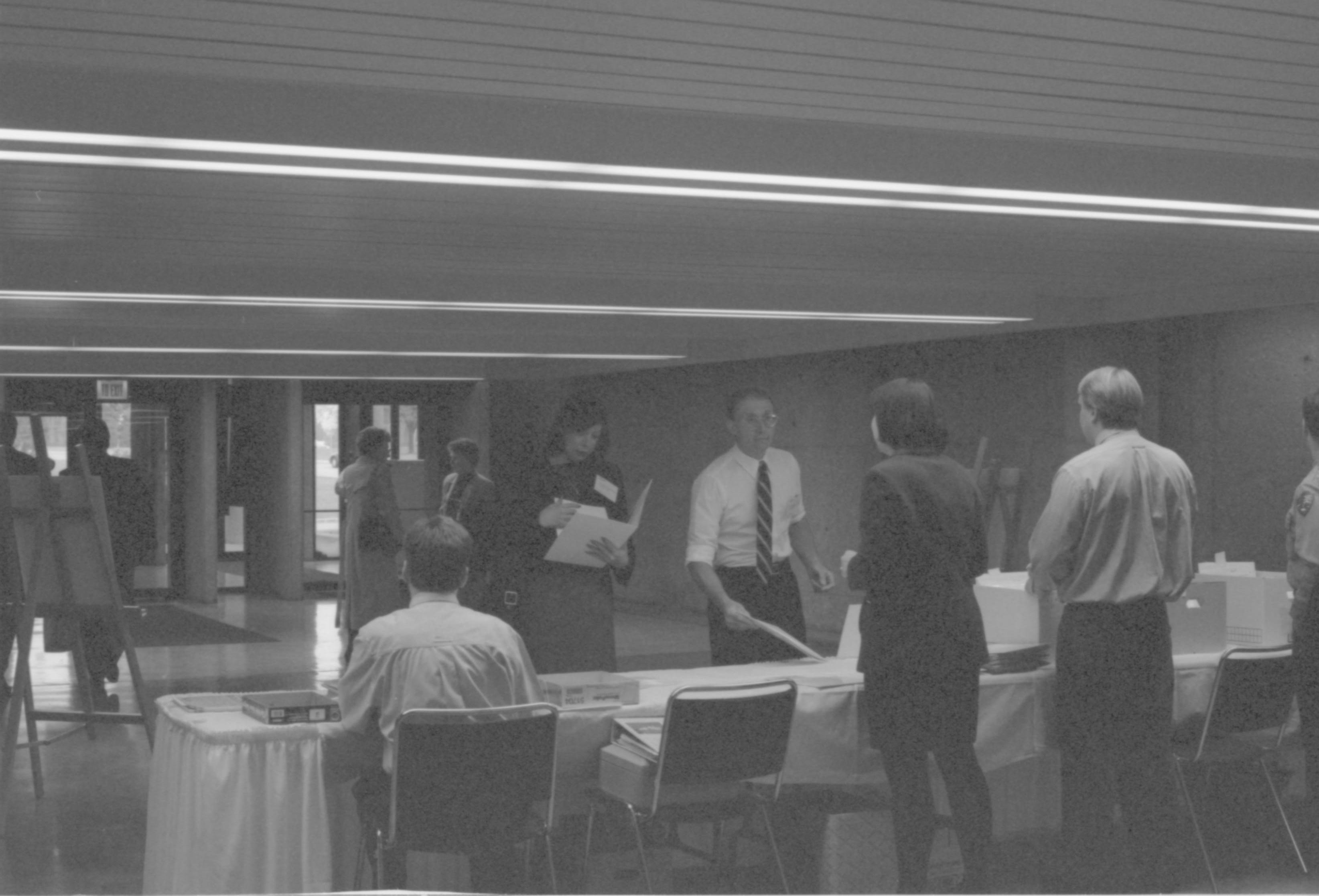 Guest arrival and LIHO-NHS staff @ check-in table. 1-1997 Colloq (b/w) Colloquium, 1997