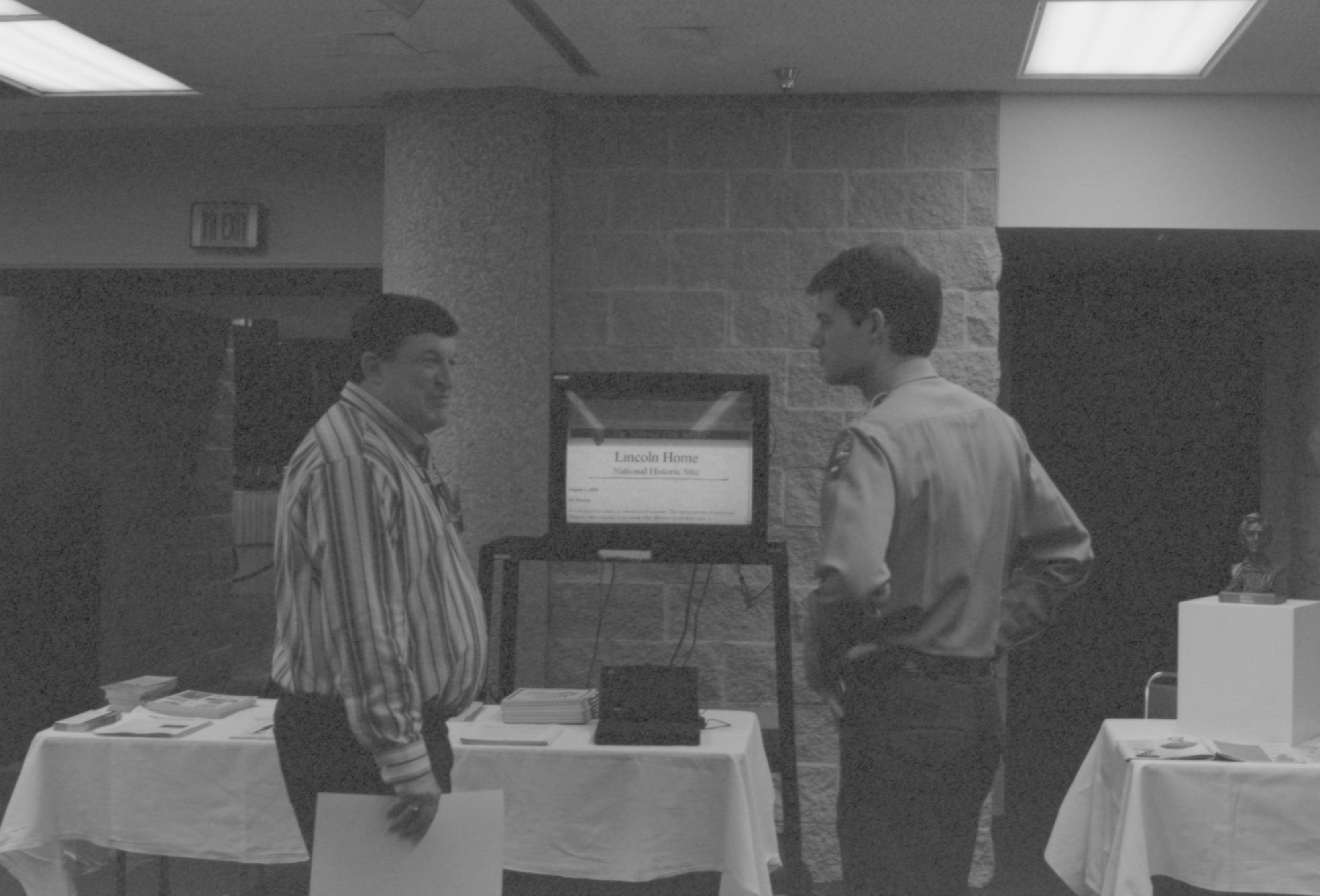 Man and Ranger in front of TV screen. 1-1997 Colloq (b/w) Colloquium, 1997