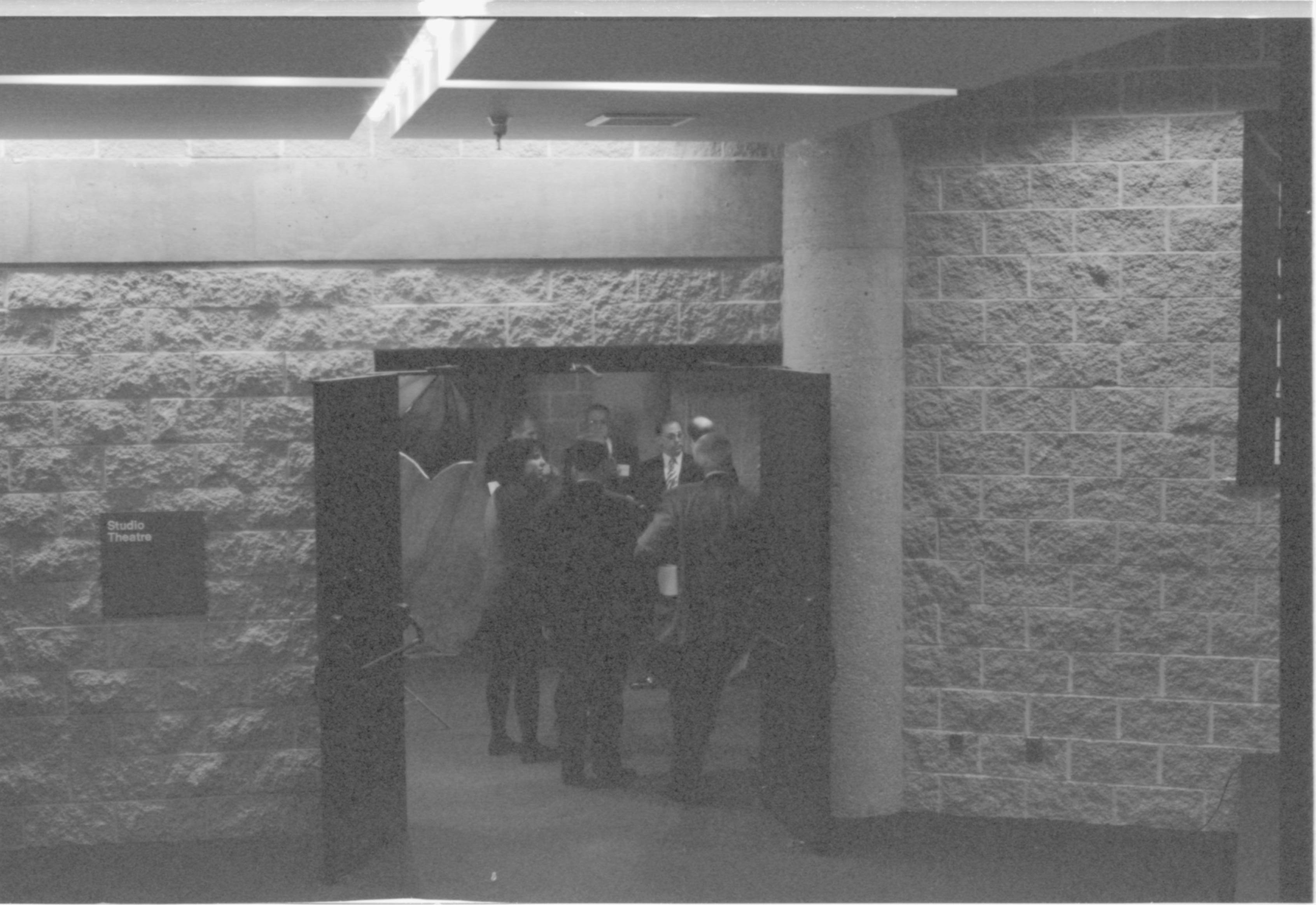 People standing in doorway. 1-1997 Colloq (b/w) Colloquium, 1997