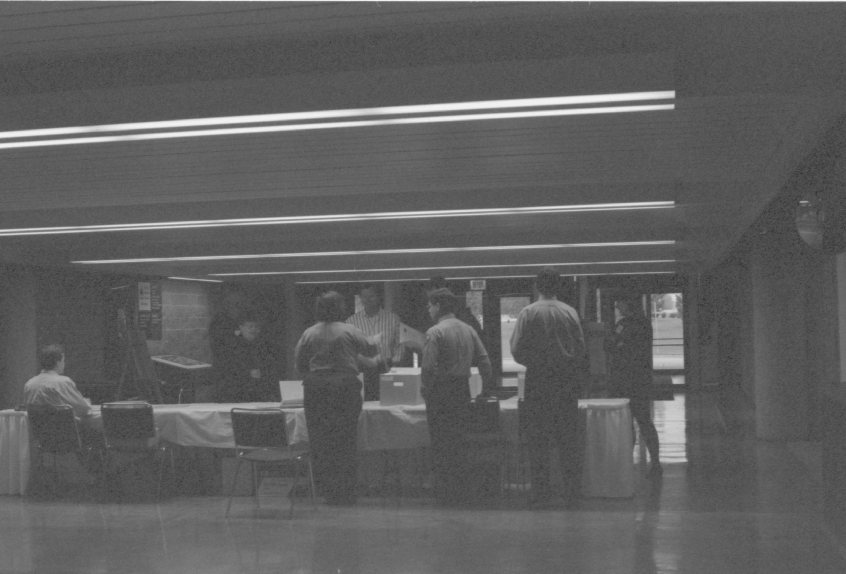 LIHO-NHS staff @ check-in table. 1-1997 Colloq (b/w) Colloquium, 1997