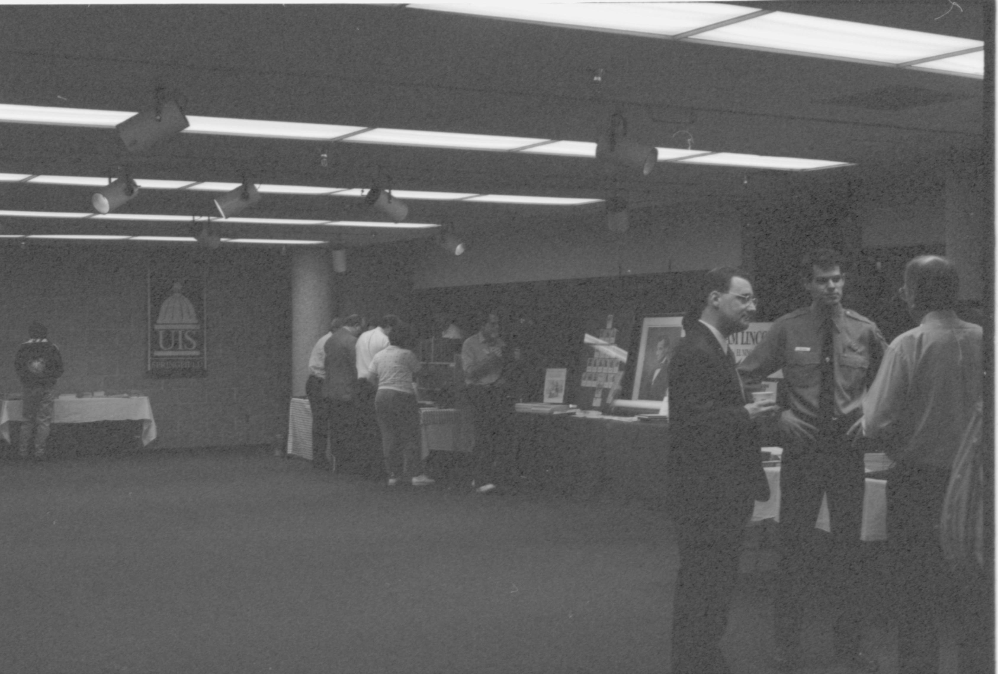 People gathered in exhibit area. 2-1997 Colloq (b/w) Colloquium, 1997