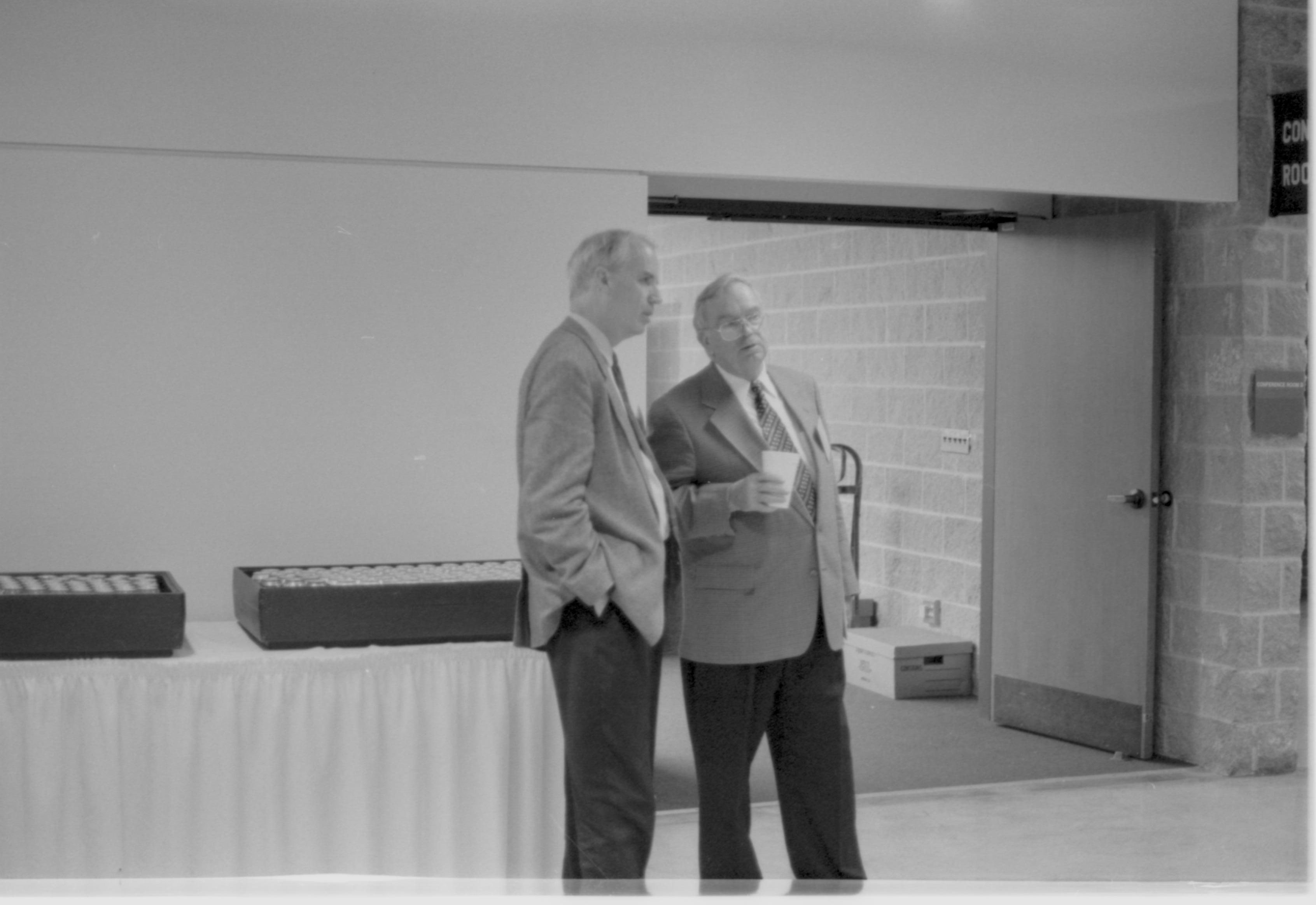 Two men standing @ refreshment table 3-1997 Colloq (b/w); 3 Colloquium, 1997