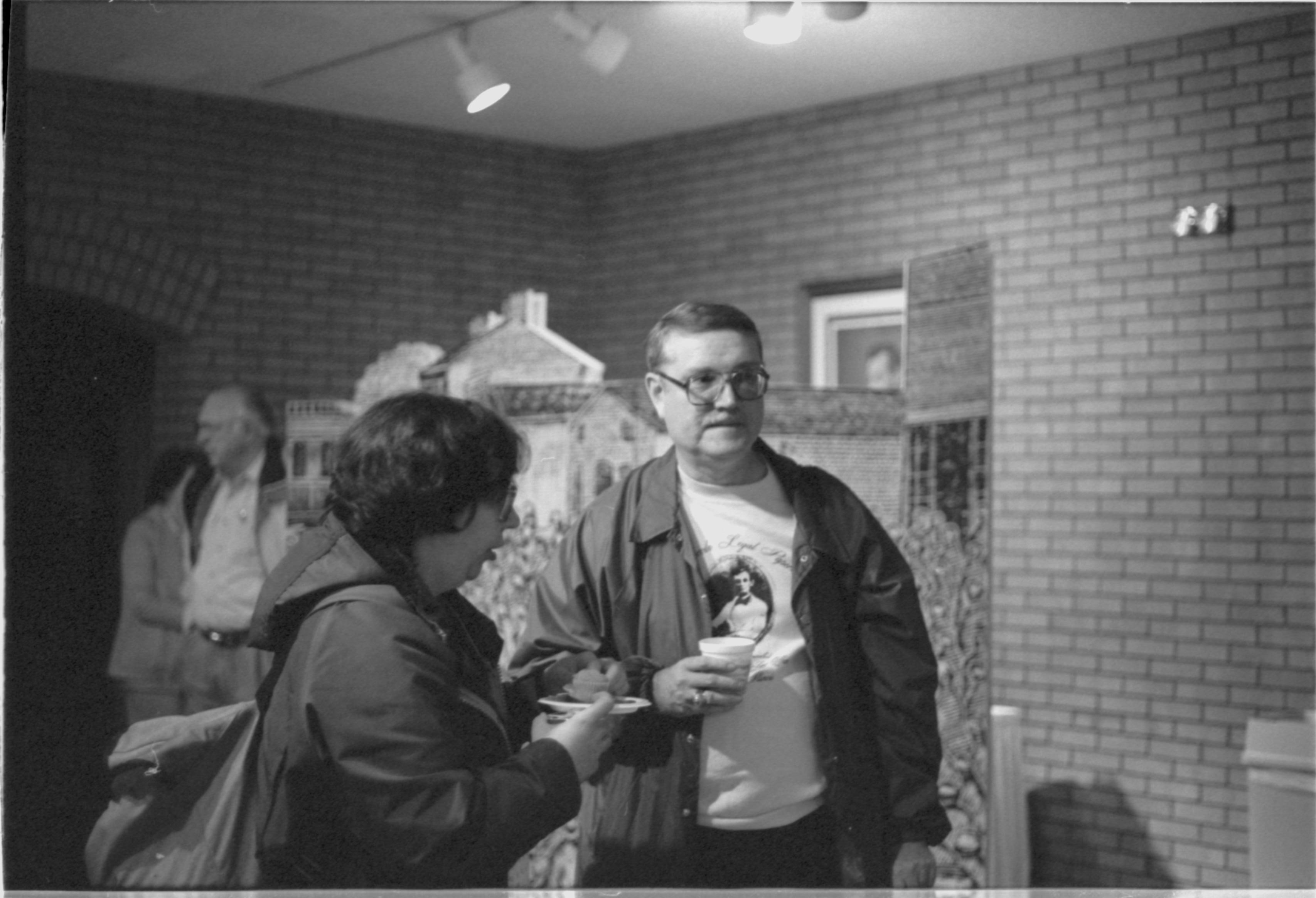 Two guests having refreshments. 3-1997 Colloq (b/w); 11 Colloquium, 1997