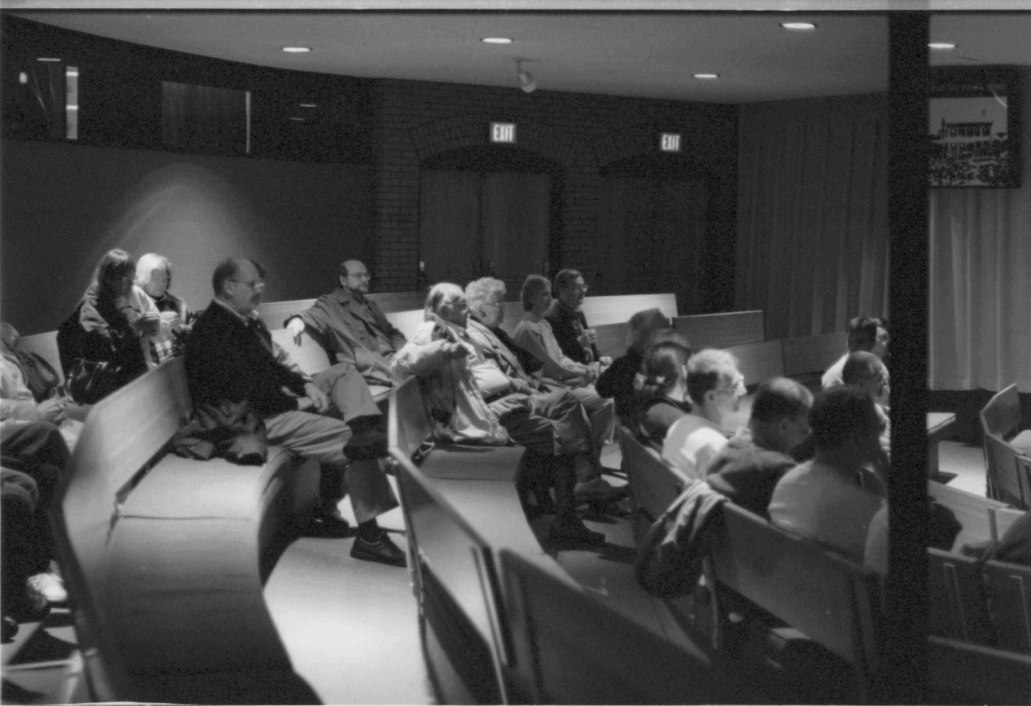 Visitors seated in theater I. 3-1997 Colloq (b/w); 20 Colloquium, 1997
