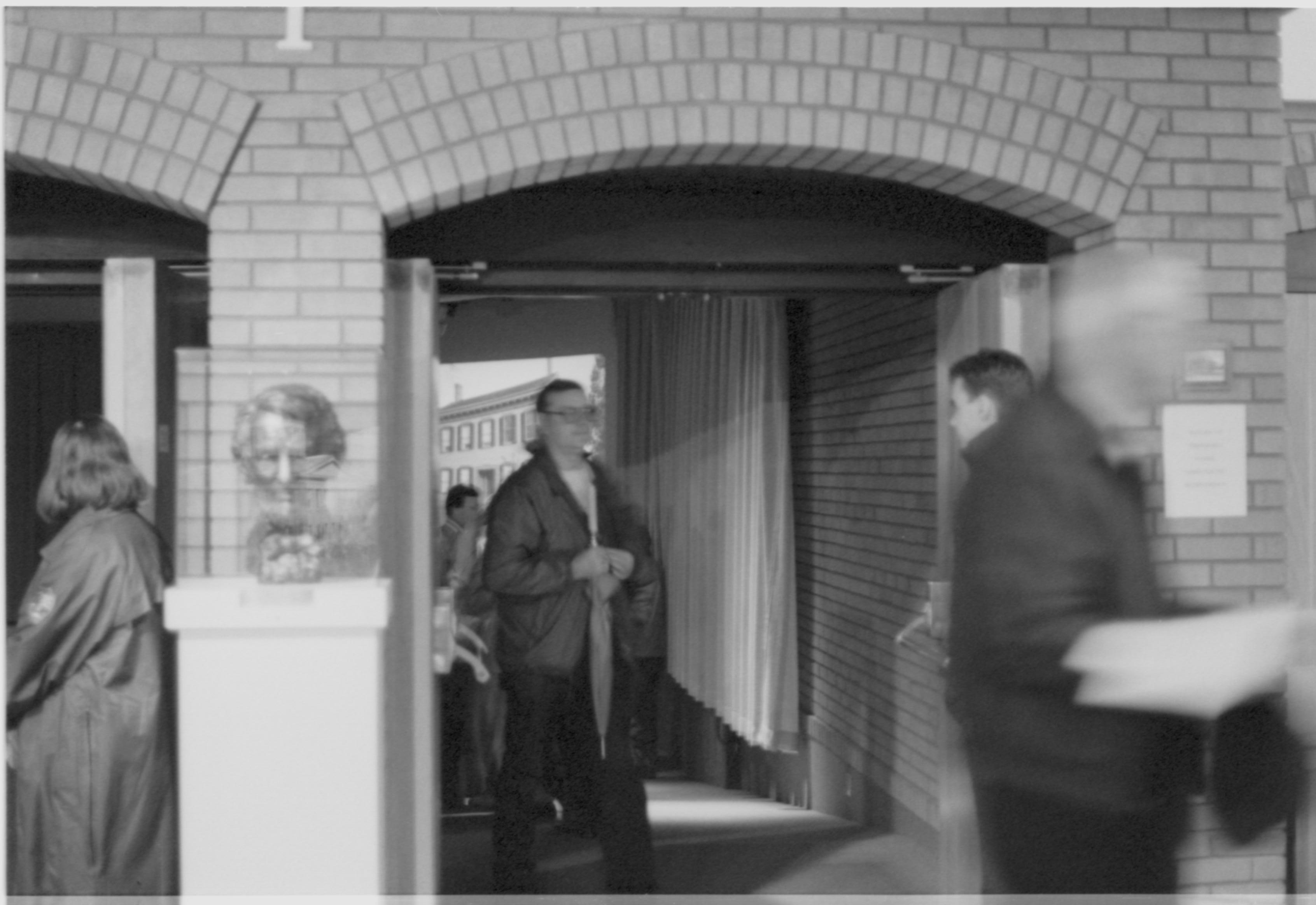 Visitors going into theater I. 3-1997 Colloq (b/w); 23 Colloquium, 1997