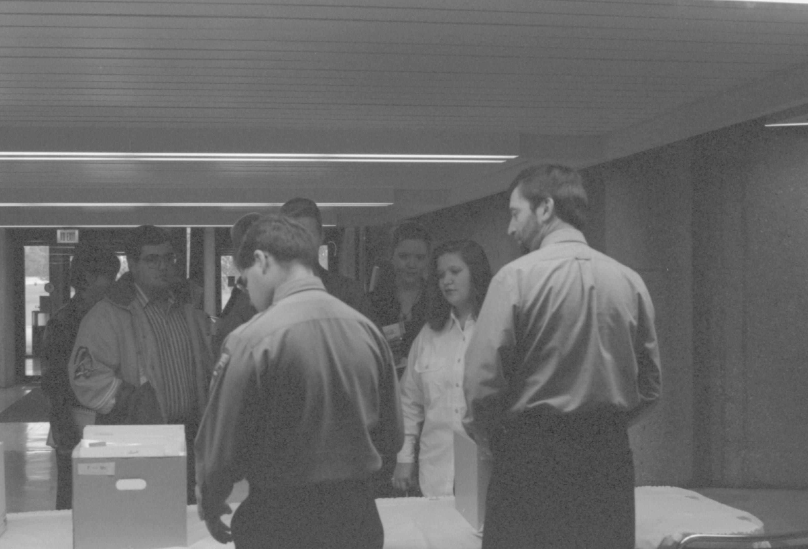Arrival of HS students - check-in table. 1-1997 Colloq (b/w) Colloquium, 1997