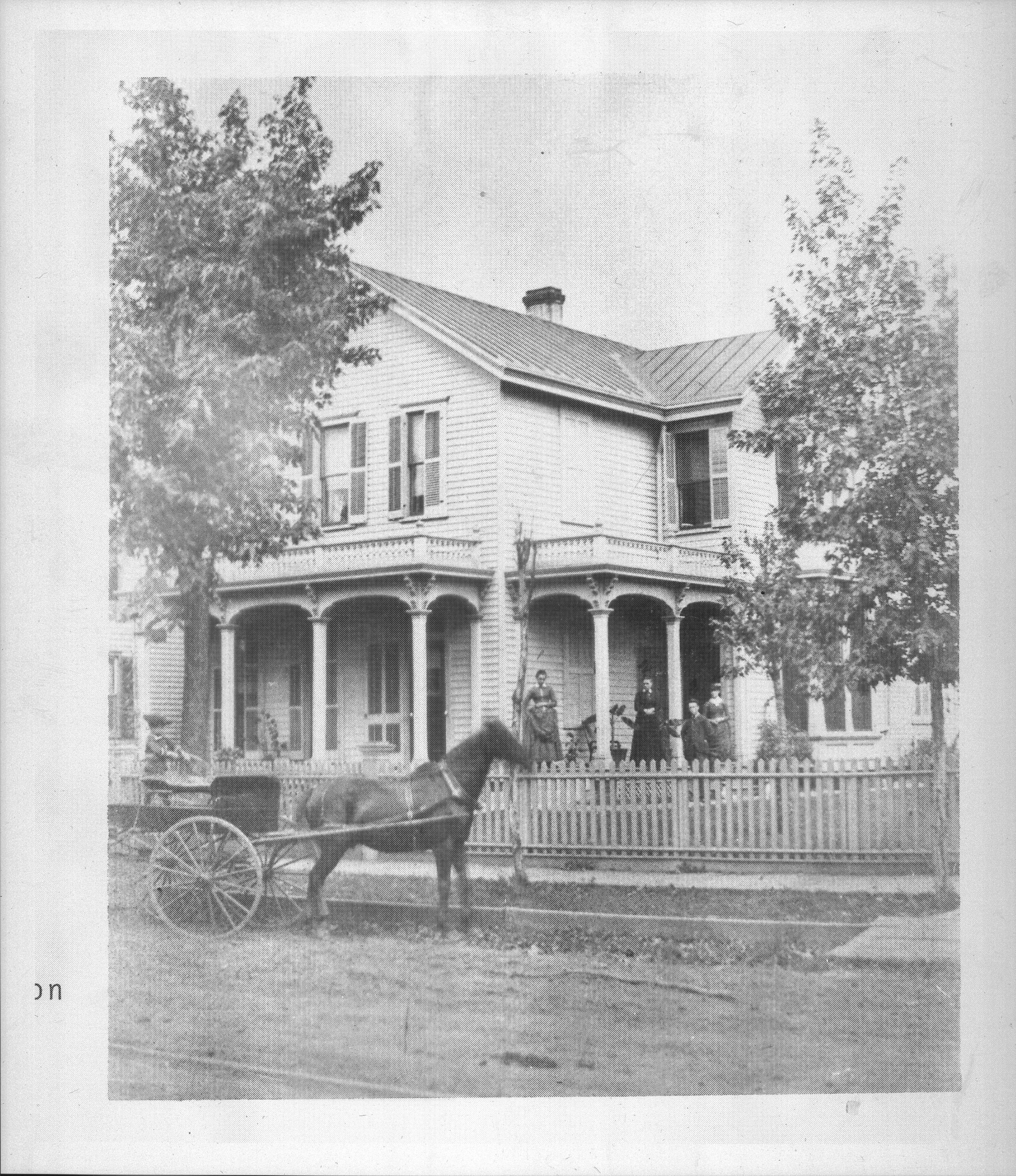 People on porch, horse and waggon in front. Robinson house, South Eighth street. Portraits, Robinson
