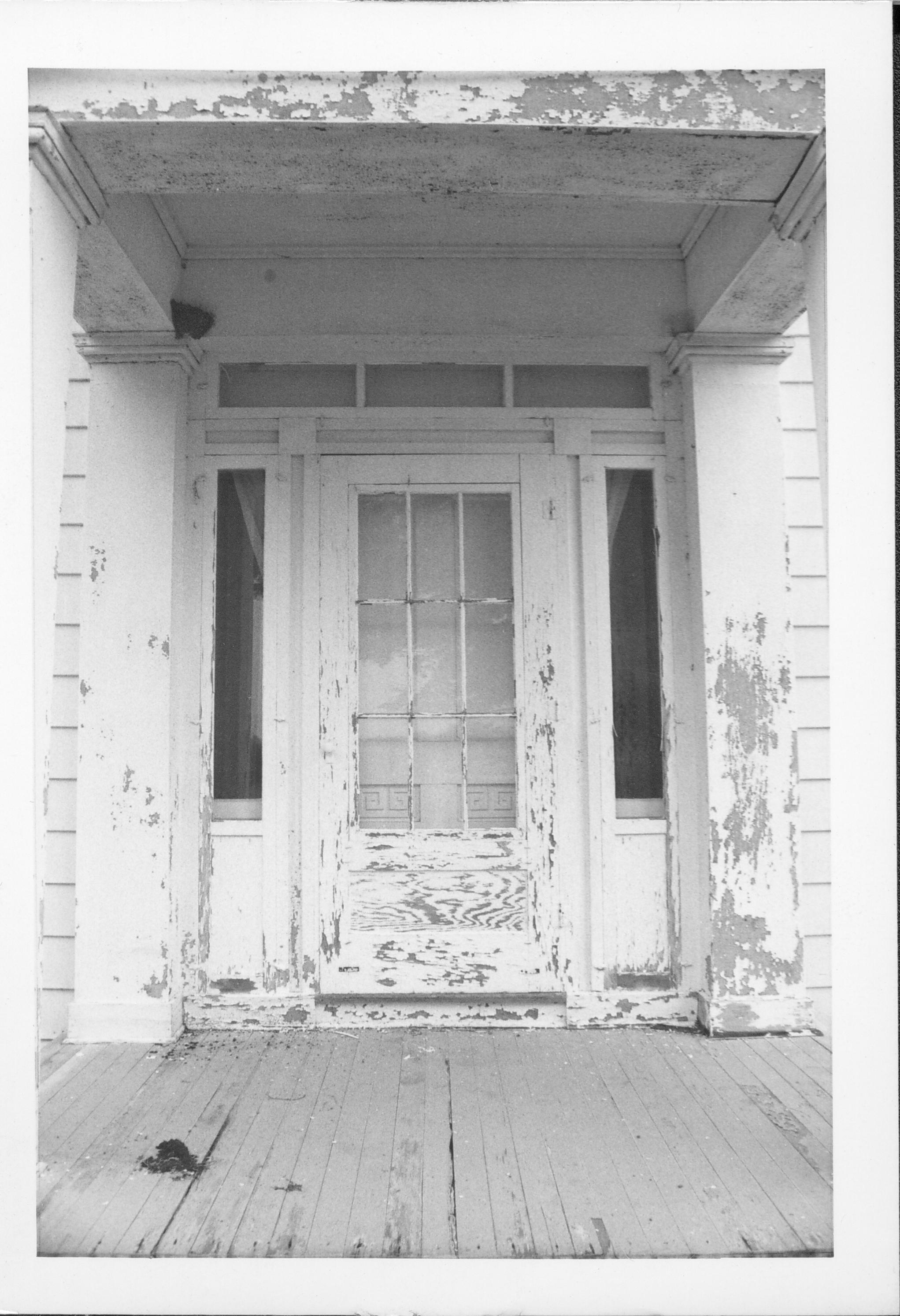 Enterance with peeling paint and porch floor. Gardner-McMillan