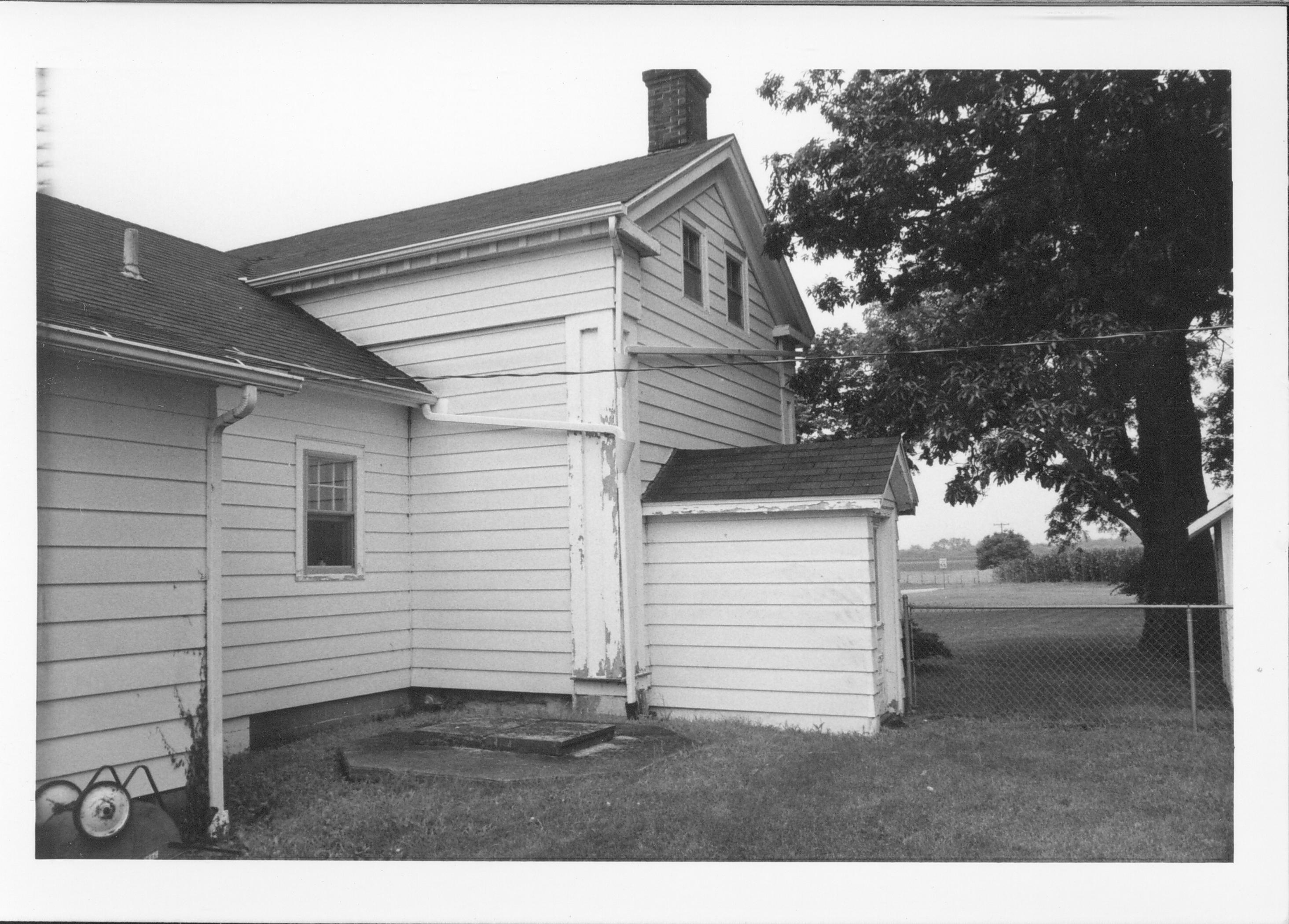 White house with entry to basement. Gardner-McMillan