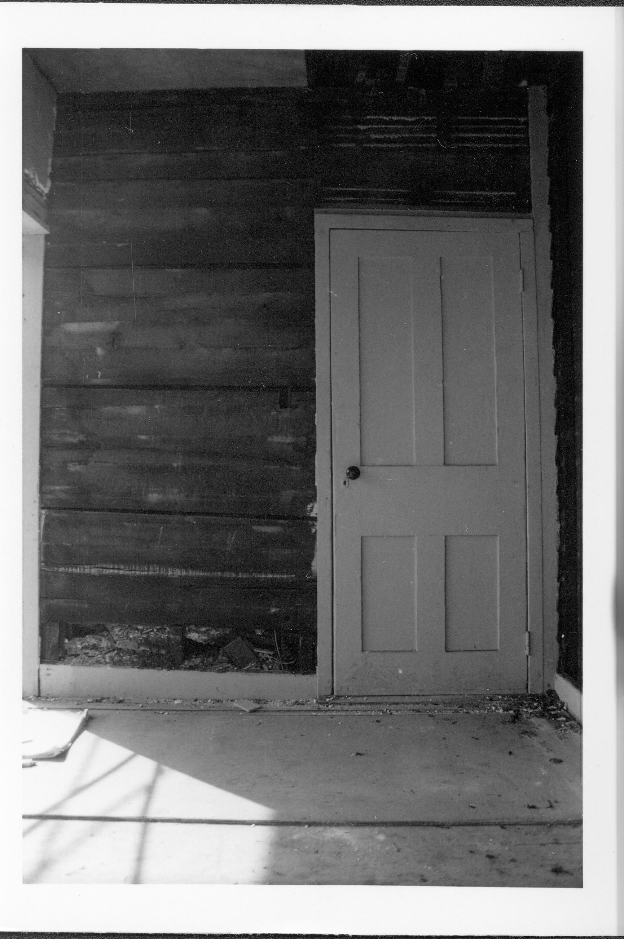 White door witn old wall exposed. Gardner-McMillan