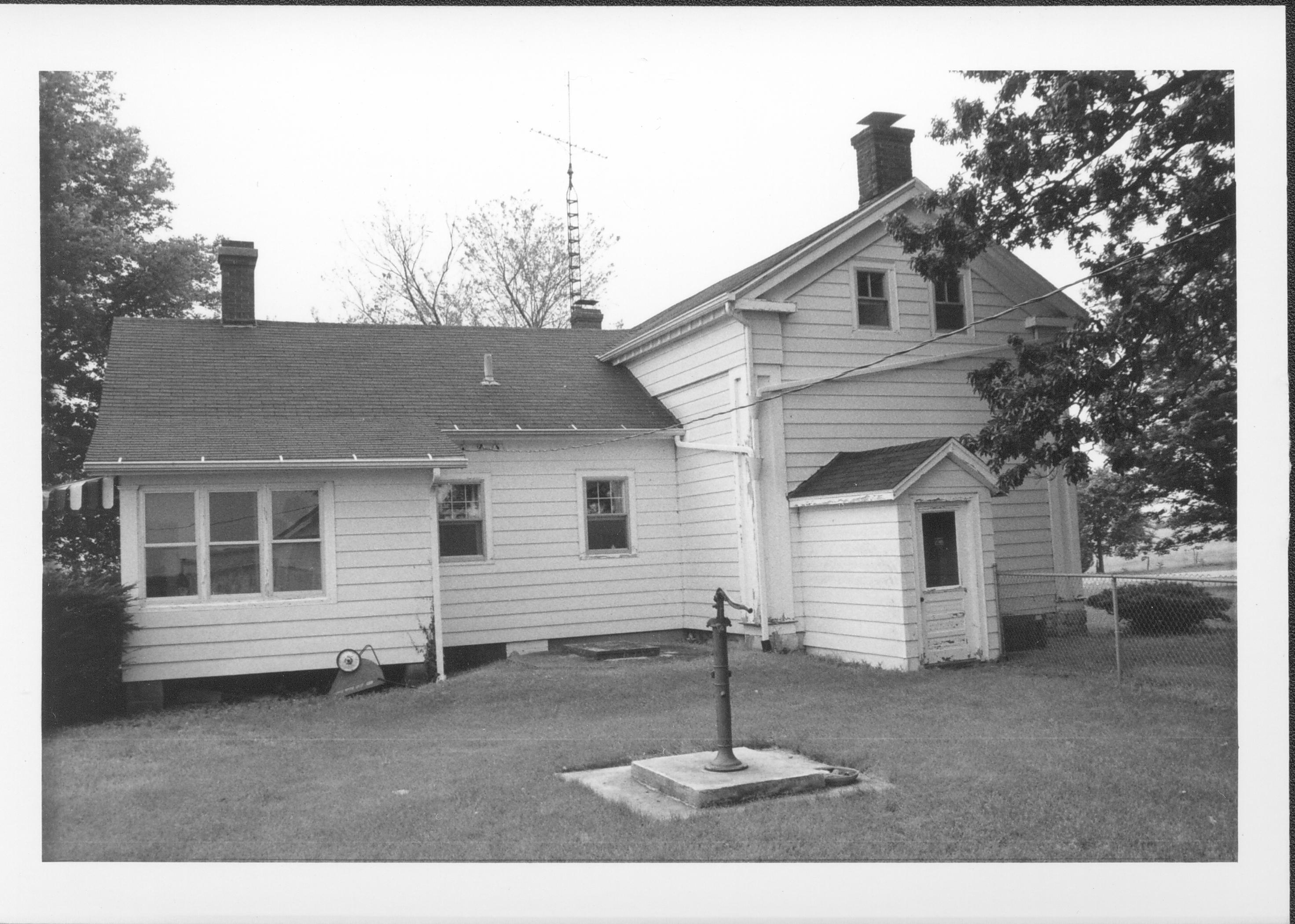 View of back of house with well pump. Gardner-McMillan