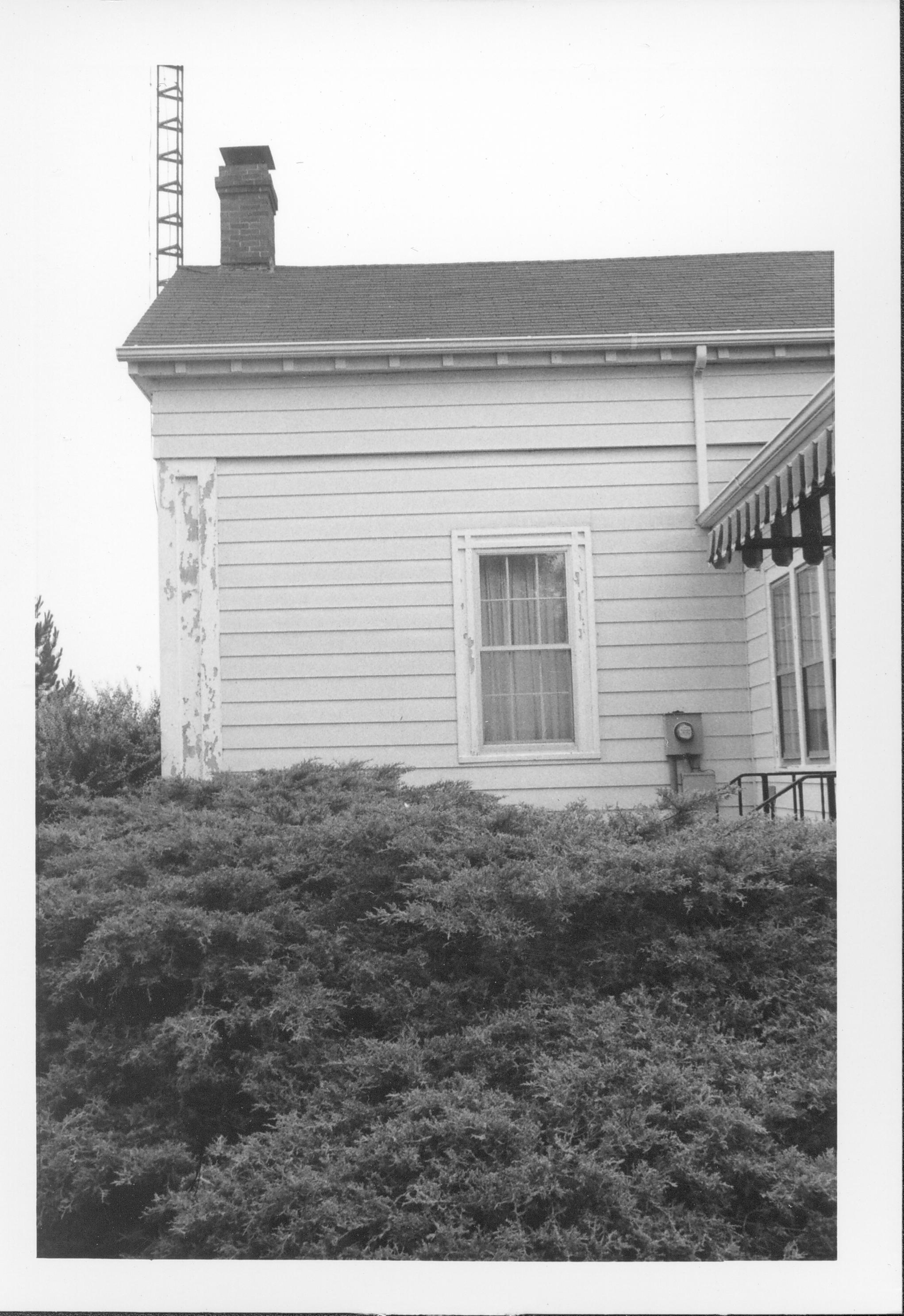 View of back of house (electric meter visable). Gardner-McMillan