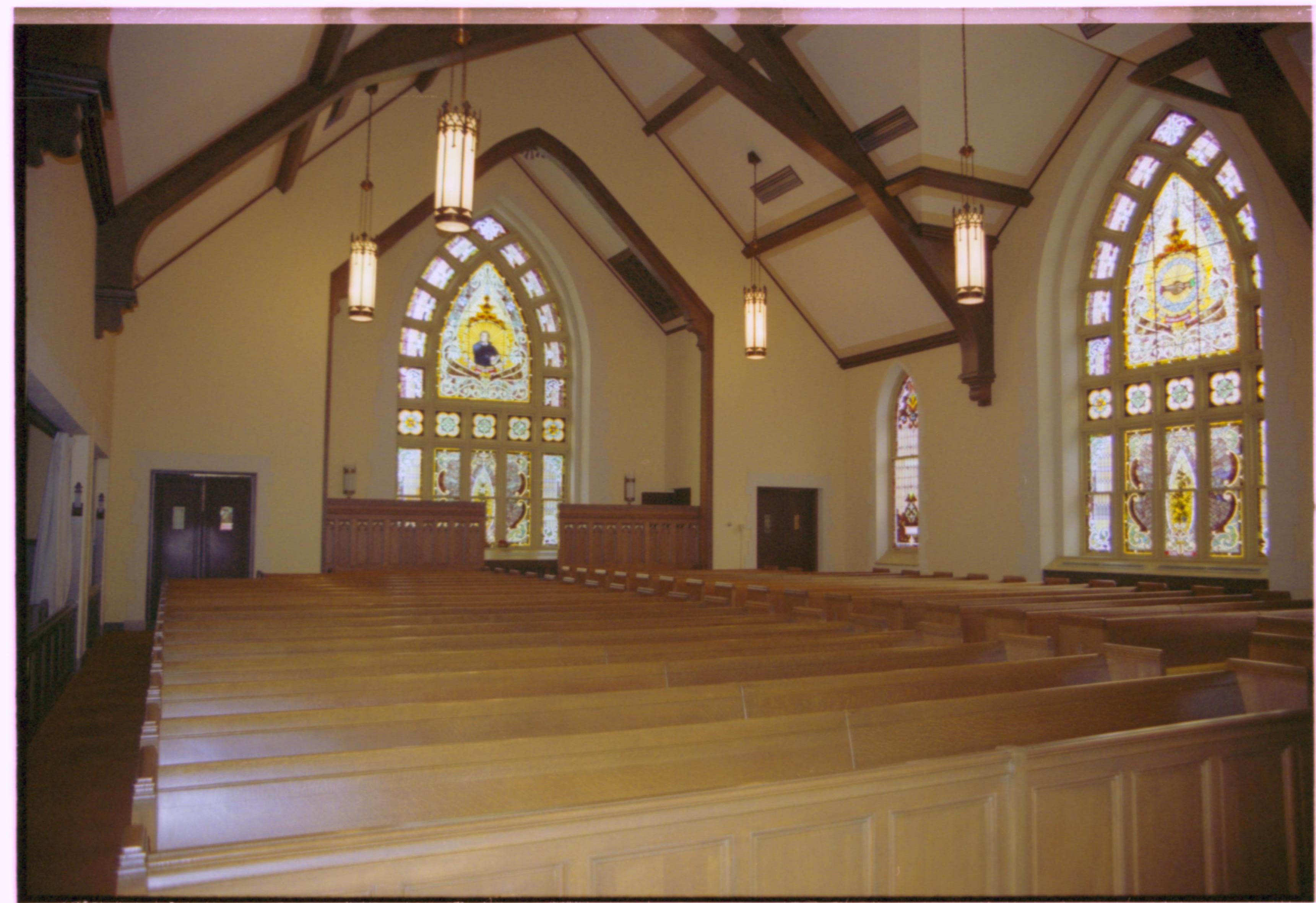 Church pews and stained glass windows. Grace Lutheran Church
