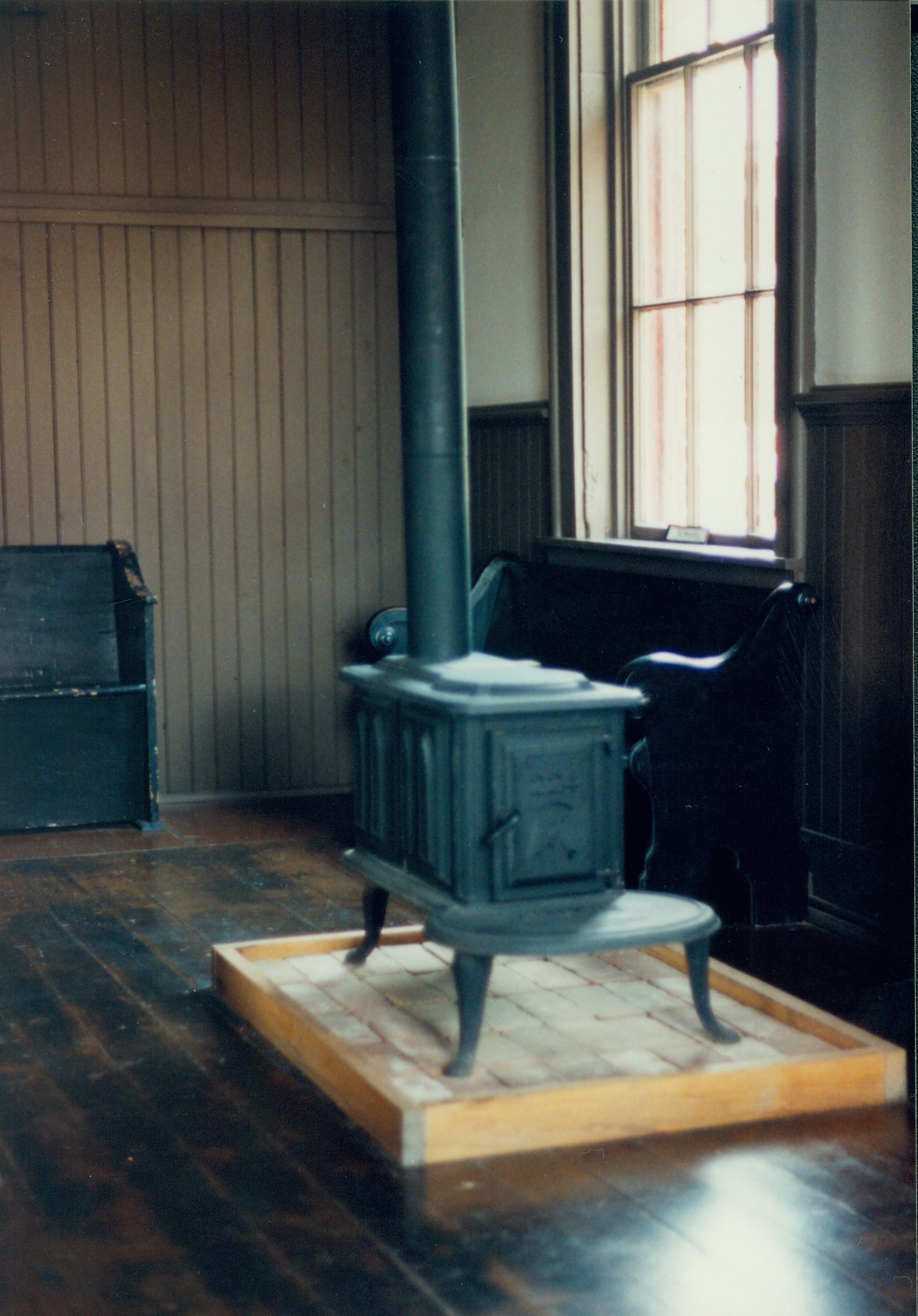 Iron stove and bench. Great Western Depot, Train Station