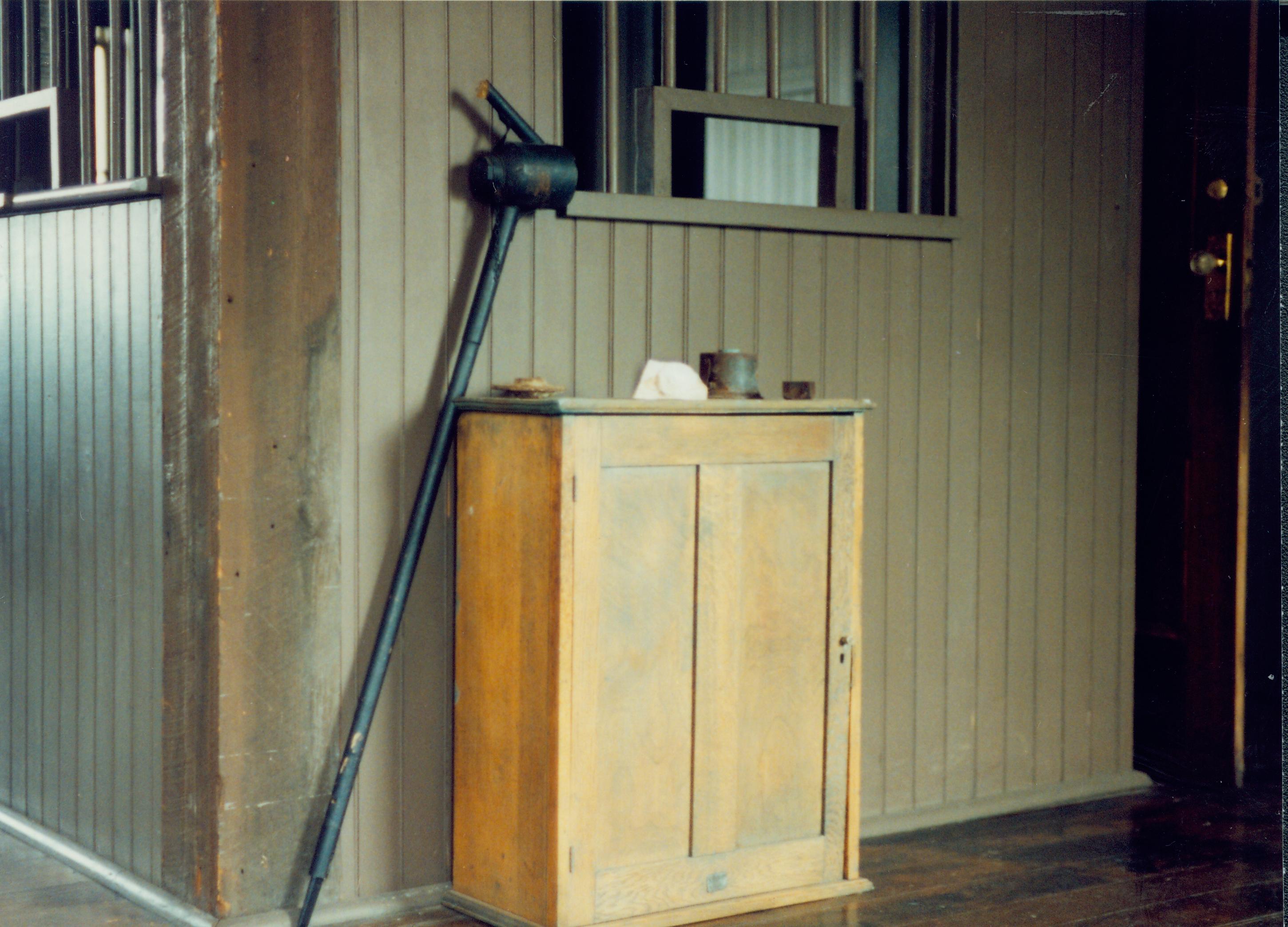 Tool leaning  against cupboard. Great Western Depot, Train Station