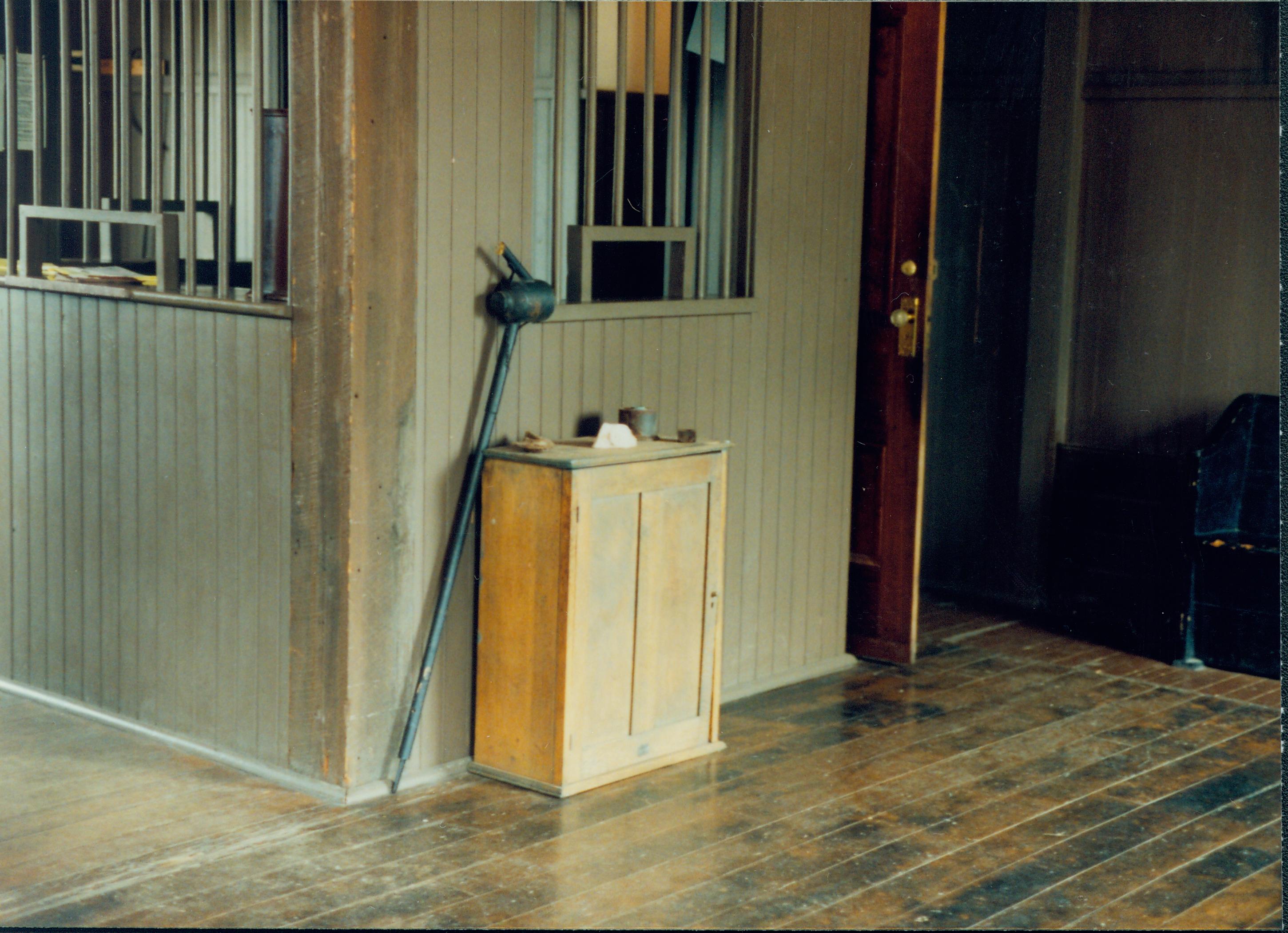 Tool leaning  against cupboard. Great Western Depot, Train Station