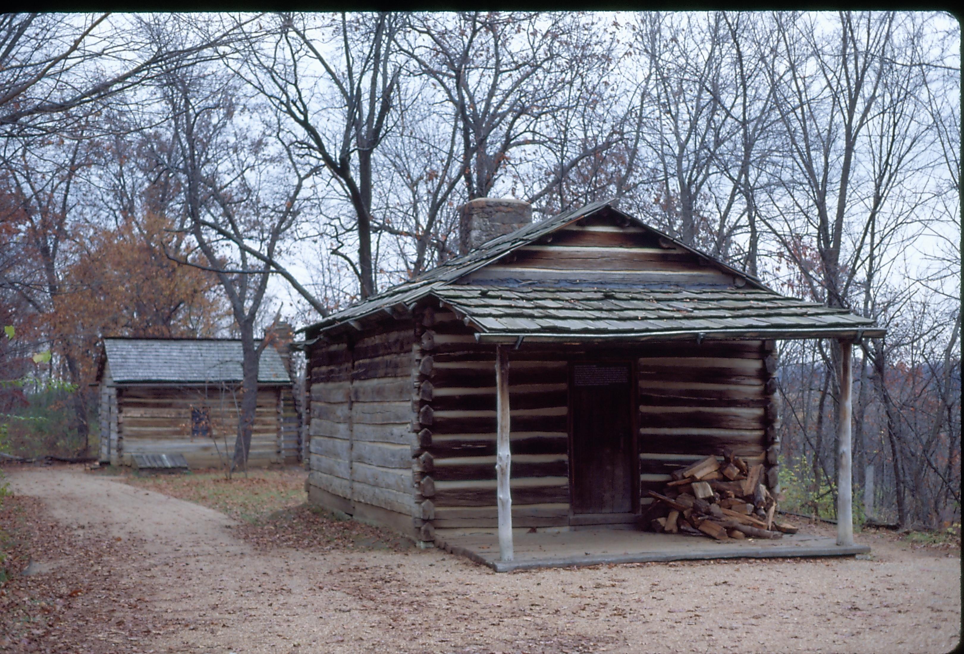 New Salem Cabin with fire wood piled up on porch. New Salem