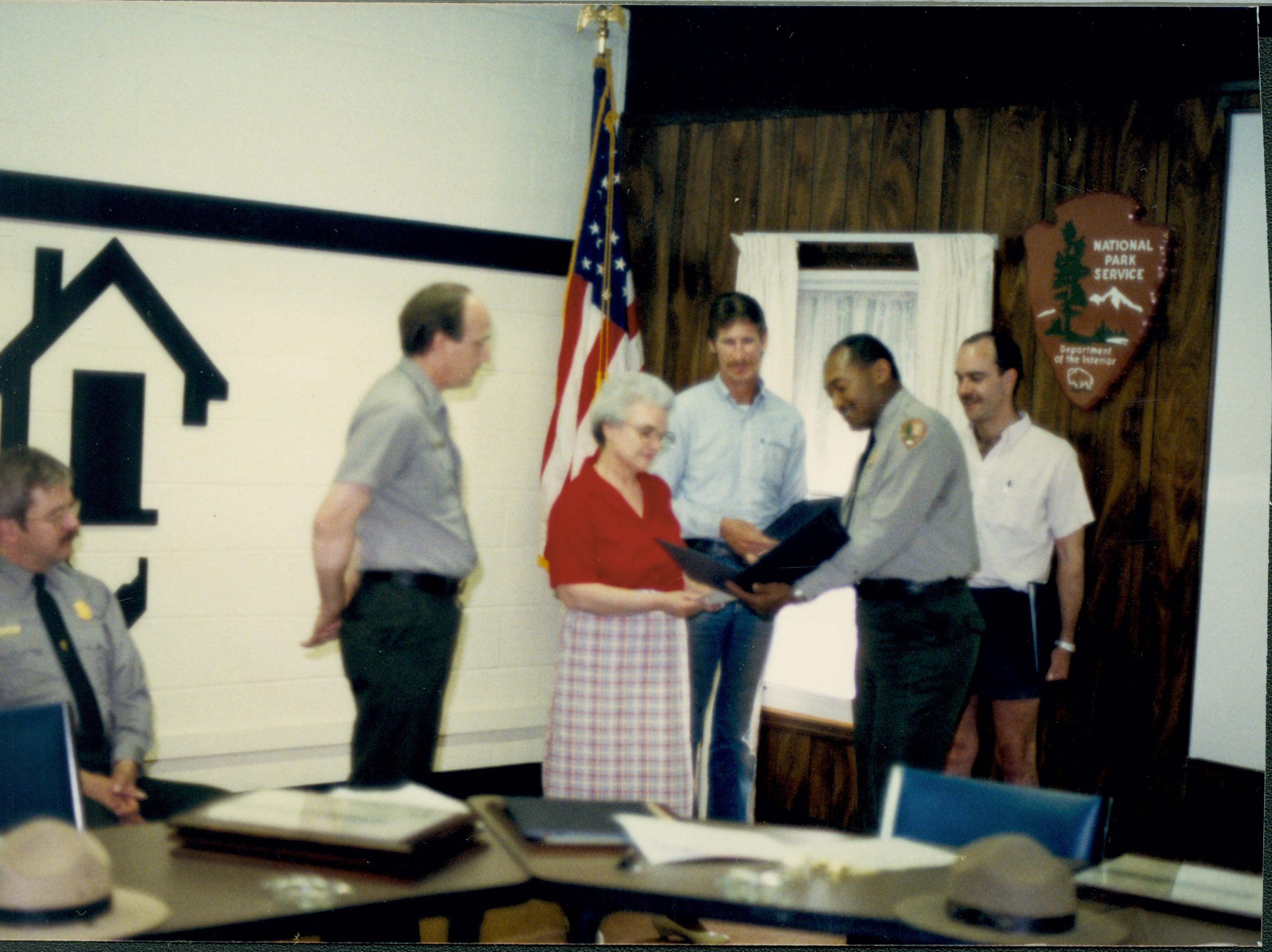 Awards Ceremony - Supt. Gentry Davis hands an award to Joyce Mavis as Rangers George Painter and Larry Blake watch, with Jason Hammond and Kelly Dodsworth. Looking Southwest in Conference Center, second floor staff, Conference Center, awards