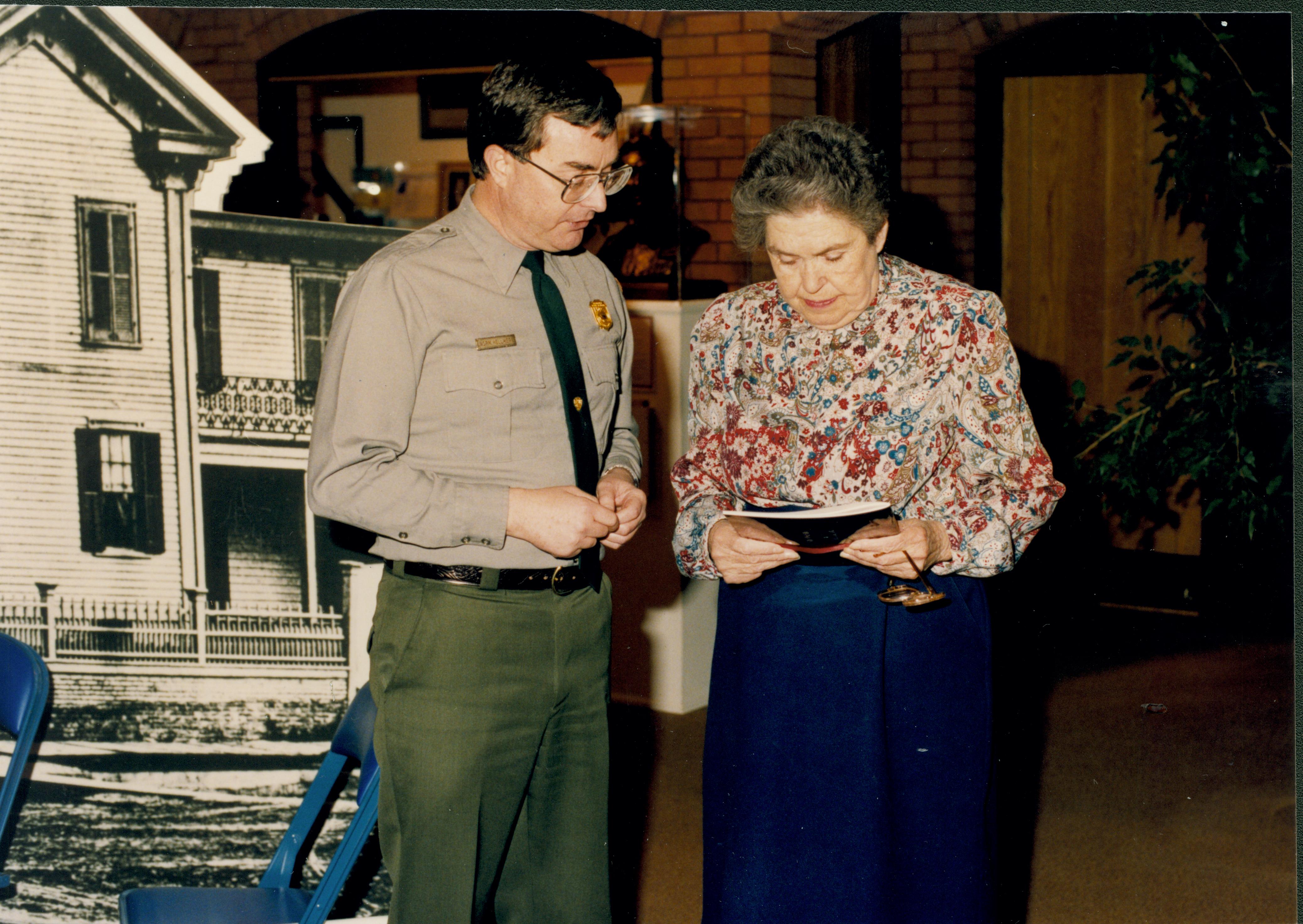 Former Ranger Ruth Ketchum with Supt. Norm Hellmers in Visitor Center Looking East near exhibits staff, Visitor Center