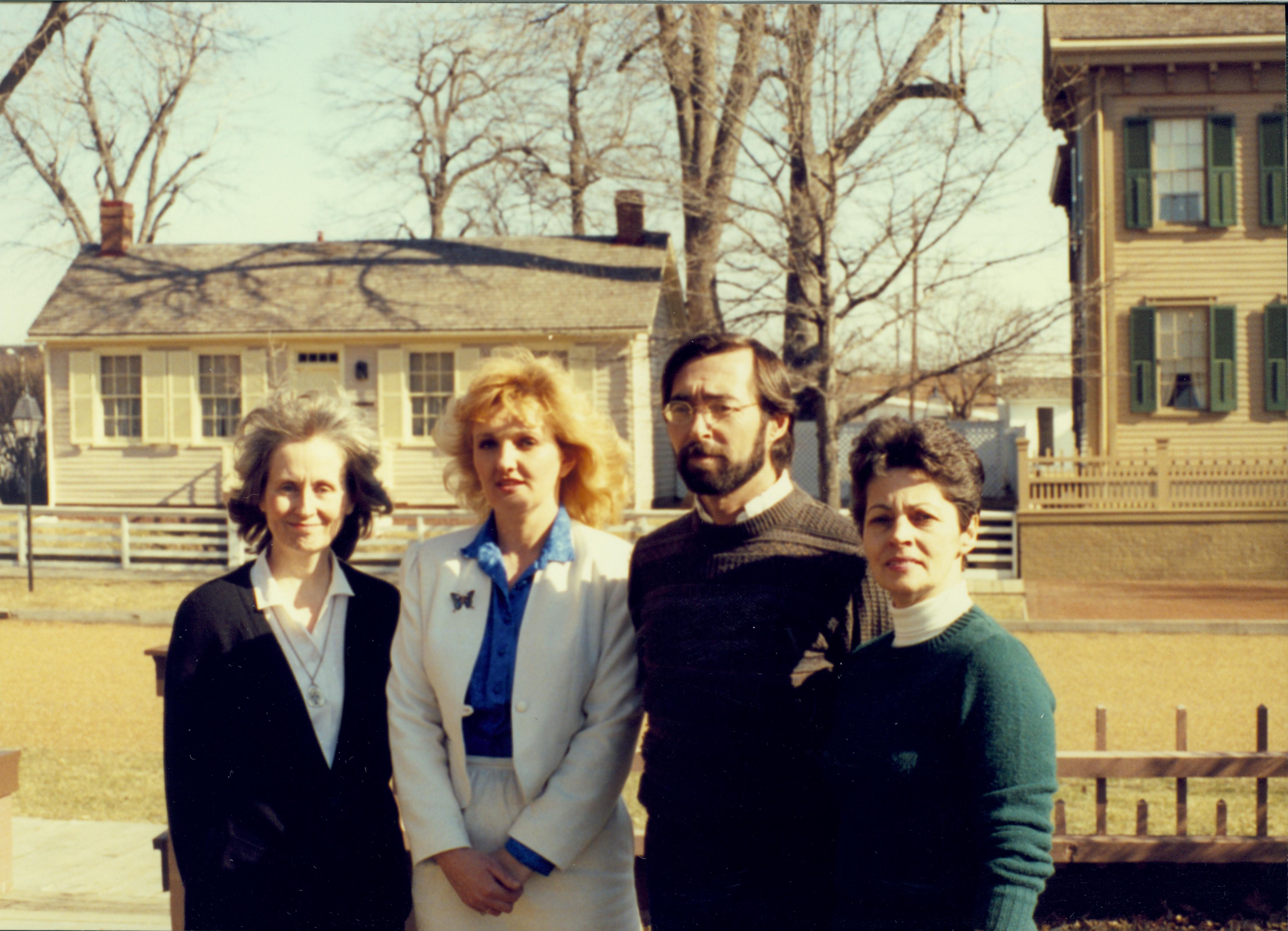 Park Administrative Staff photo in Brown lot Looking east. Corneau House and Lincoln Home in background. From left to right: Nancy Hudson, ?, Fran Krupka, Rena Lowder.