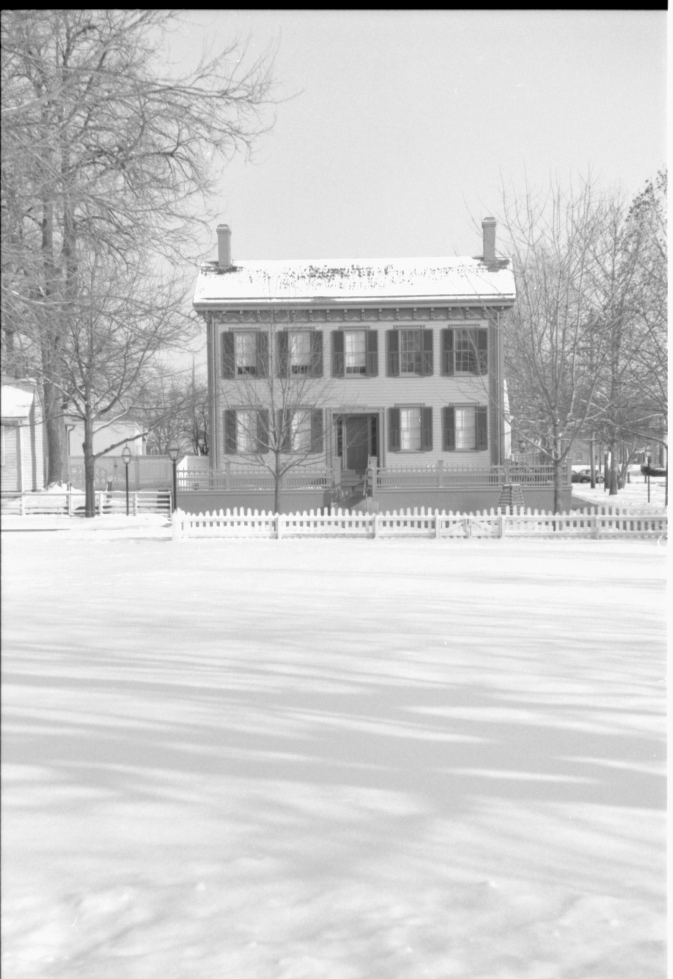 Lincoln Home in snow. Corneau House on far left, B-2 in background behind Corneau, Burch lot in foreground Looking East from Burch Lot, Block 7, Lot 9 snow, Lincoln Home, Corneau, B-2, Burch Lot