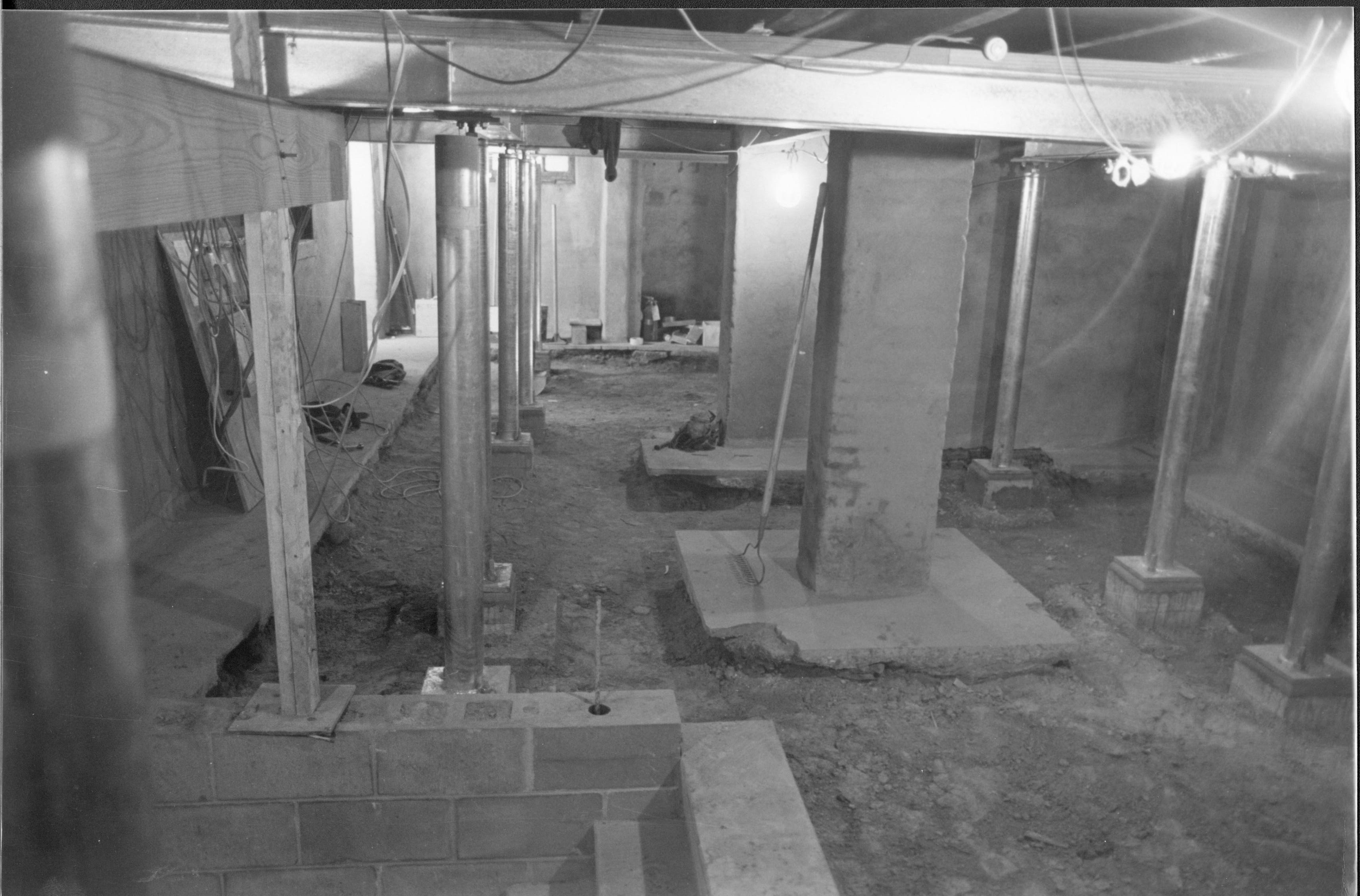 Columns and stell beams were installed in the basement of the Lincoln Home to provide additional support for the first floor. Basement Lincoln Home, Restoration, Basement, Structural reinforcements