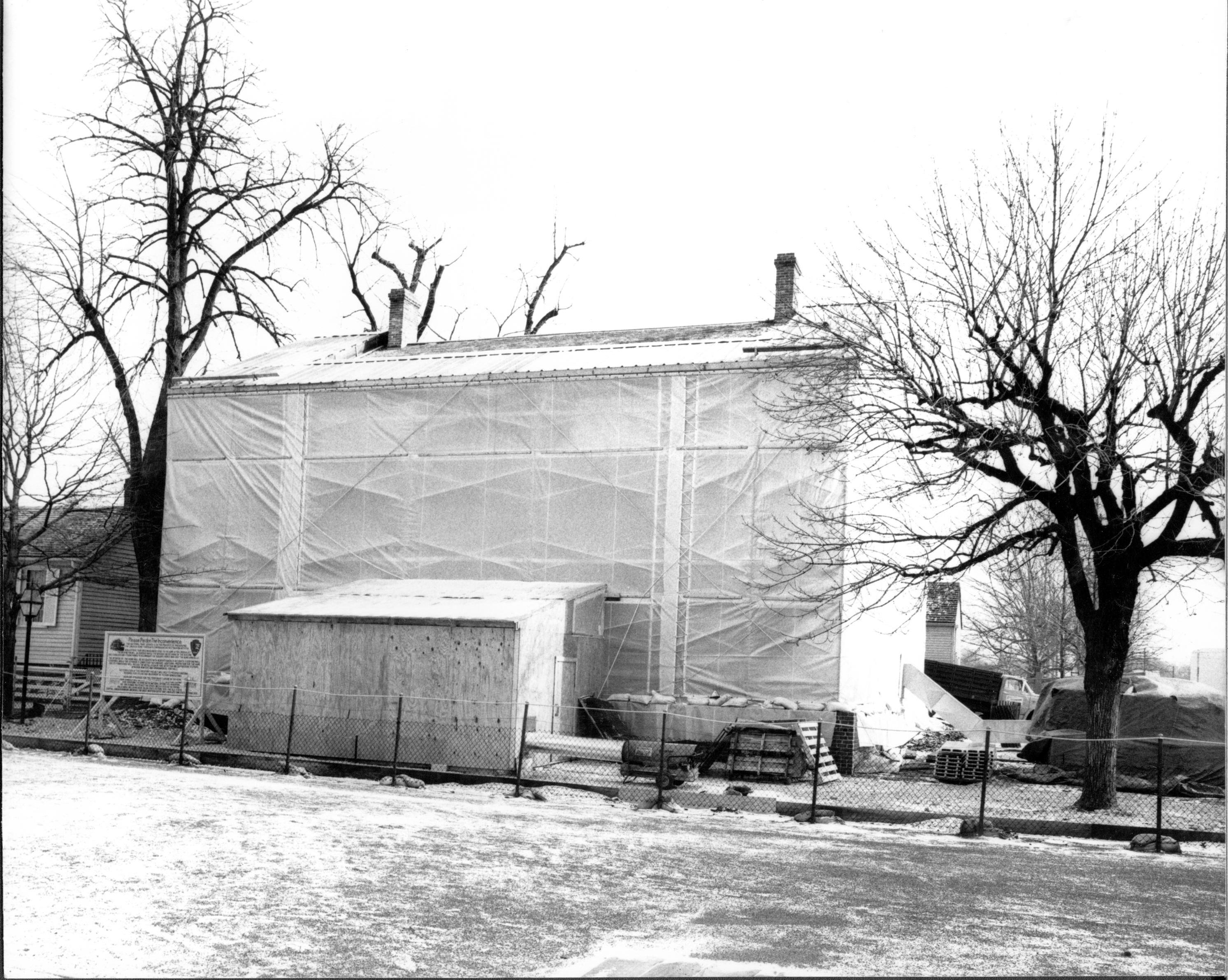 Lincoln's Home is protected by a giant plastic tent-like structure to facilitate the 1.7 million dollar restoration project currently underway. This shelter helps to maintain a temperature which allows work to continue regardless of the weather and temper Lincoln, home, restoration, tent
