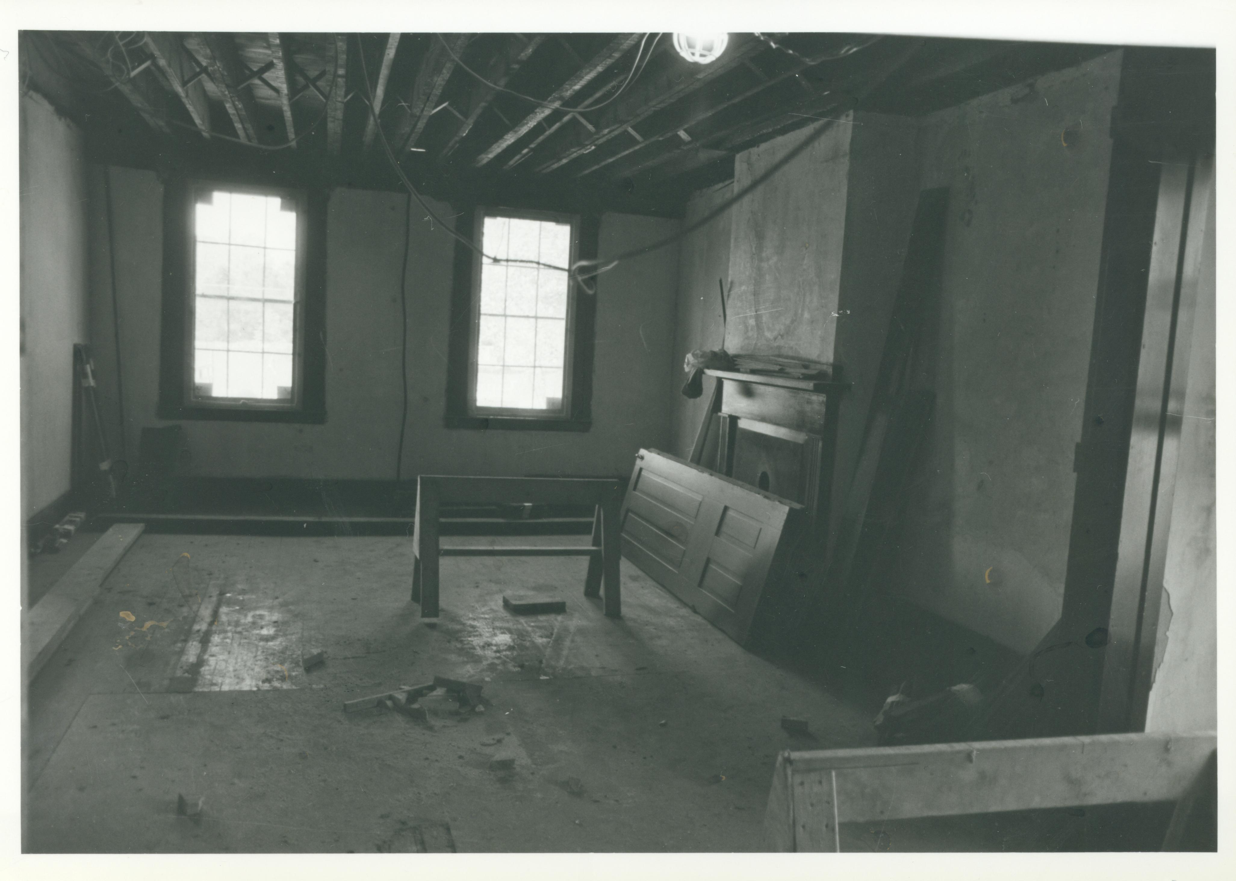 The Front Parlor of the Lincoln Home is shown undergoing restoration. The ceiling has been opened up so structural steel beams can be installed to reinforce the floor joists. 18-Aug Lincoln, Home, Restoration, back, parlor