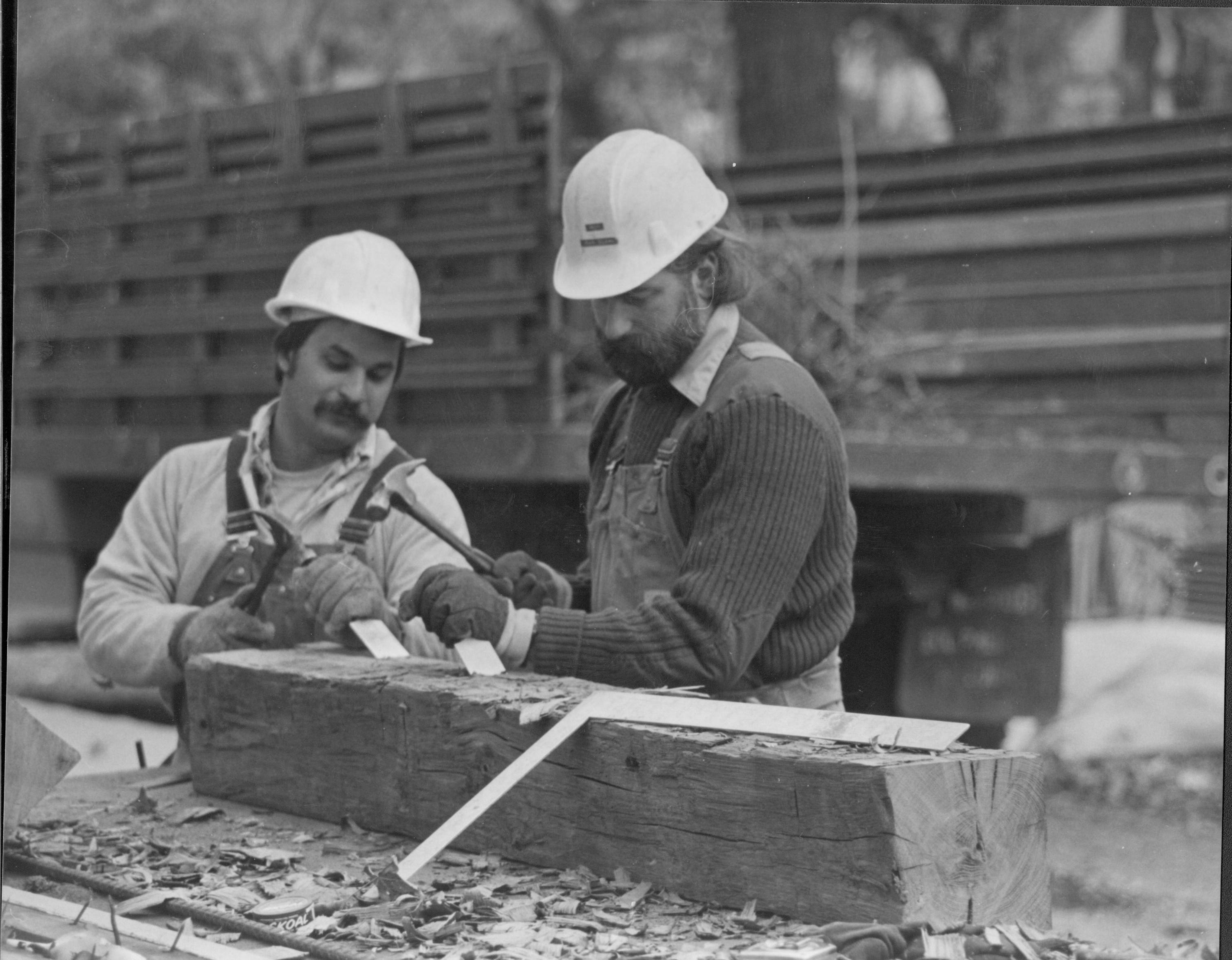 NA Restoration workers are hewing a replacement oak beam to replace a sill beam from the Lincoln Home. Restoration, Workers