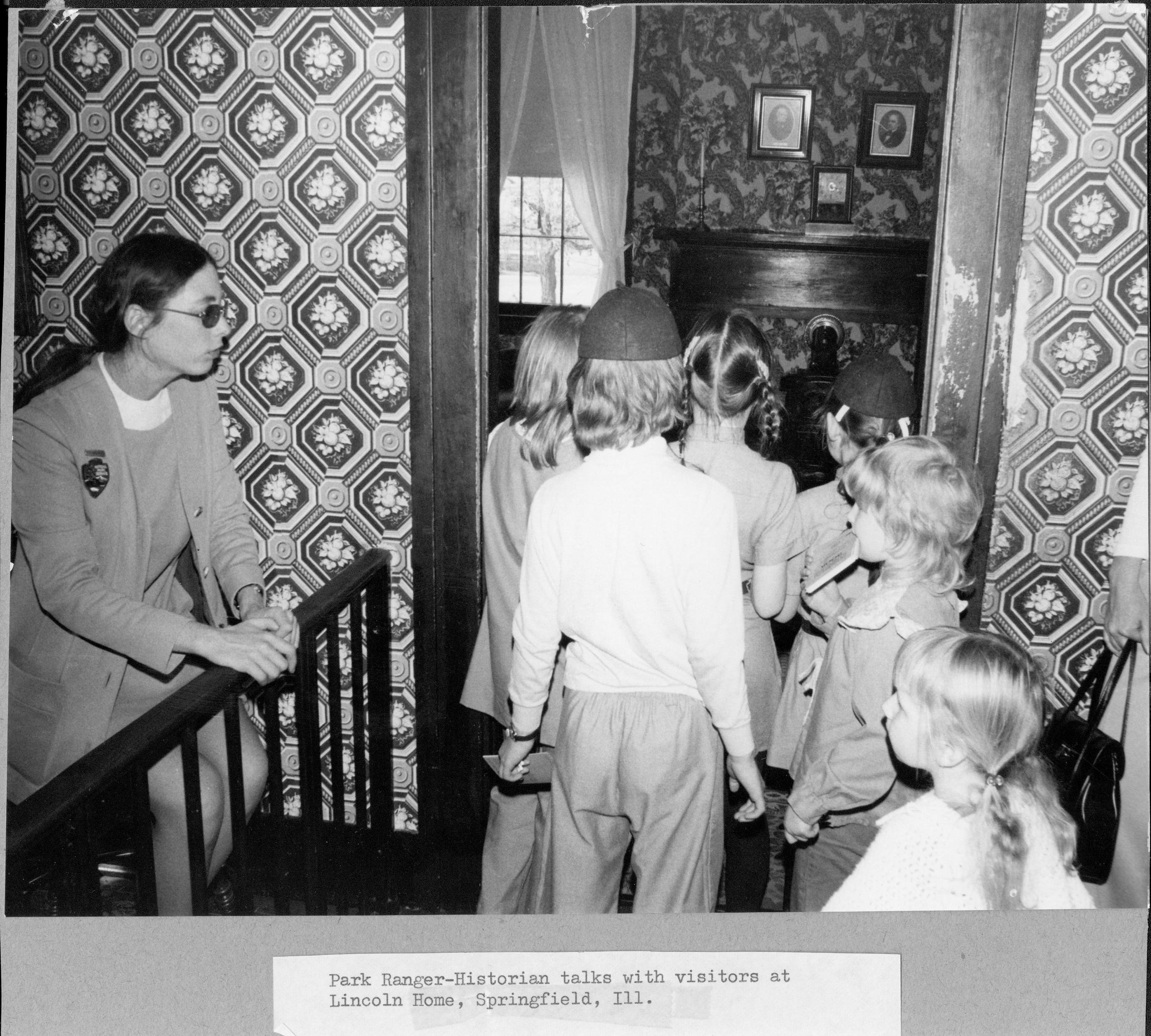 Park Ranger-Historian talks with visitors at Lincoln Home, Springfield, Ill. Interpretation, Tours, Visitation