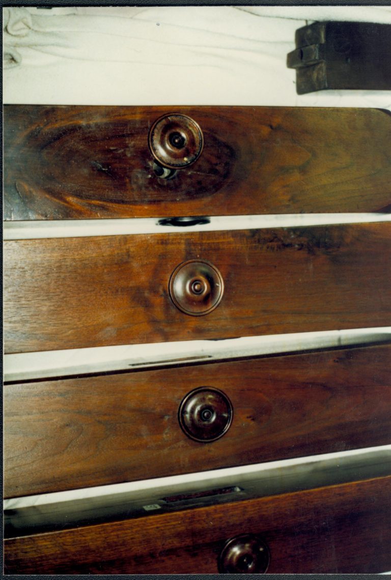 Shows one of three replacemtn bed bolt covers (middle) Lincoln Home NHS catalog 57, #57 furnishings