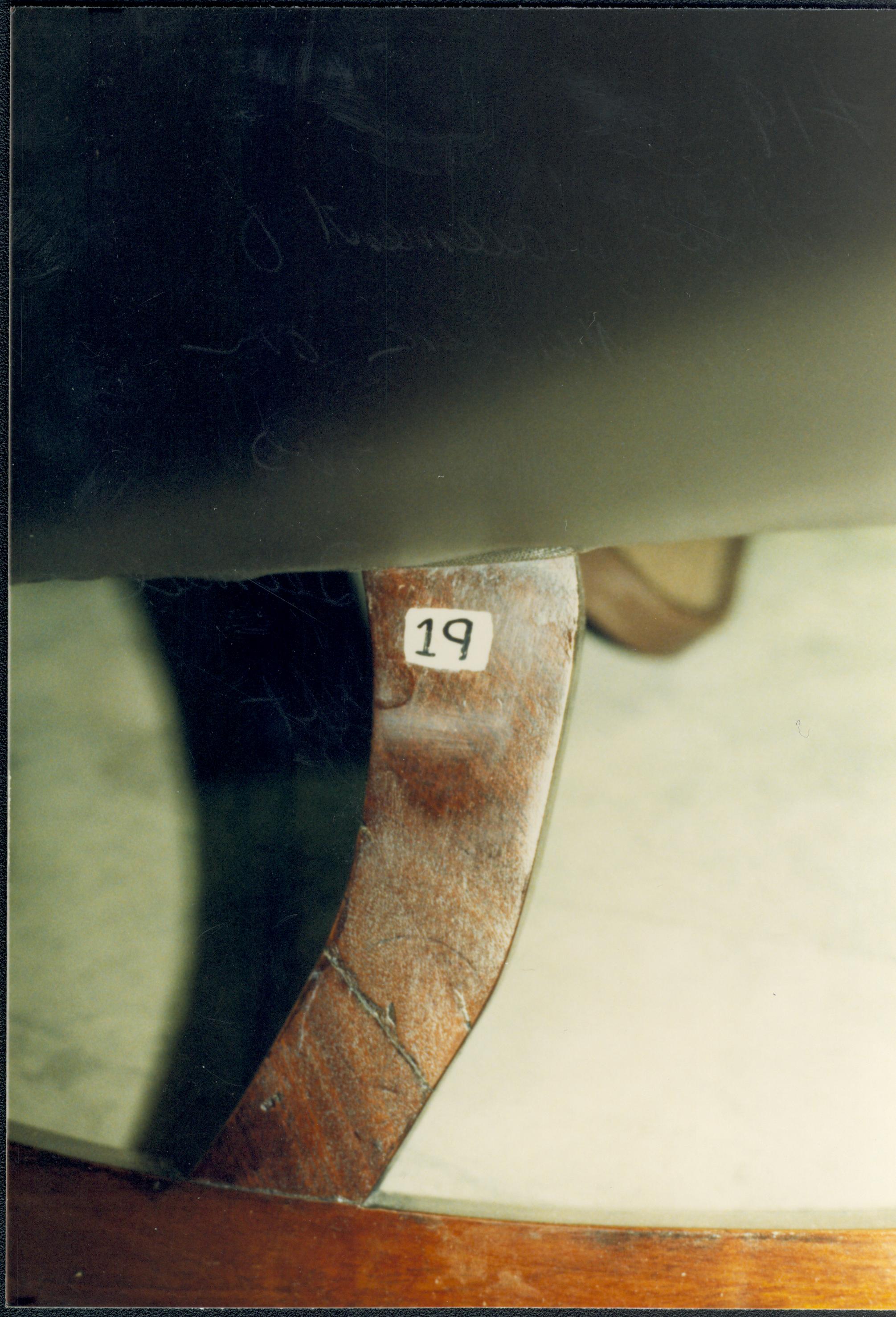 Show placement of catalog number on leg. Also shows previous repair deemed stable and left undisturbed Lincoln Home NHS Catalog 19, #19 furnishings, chair