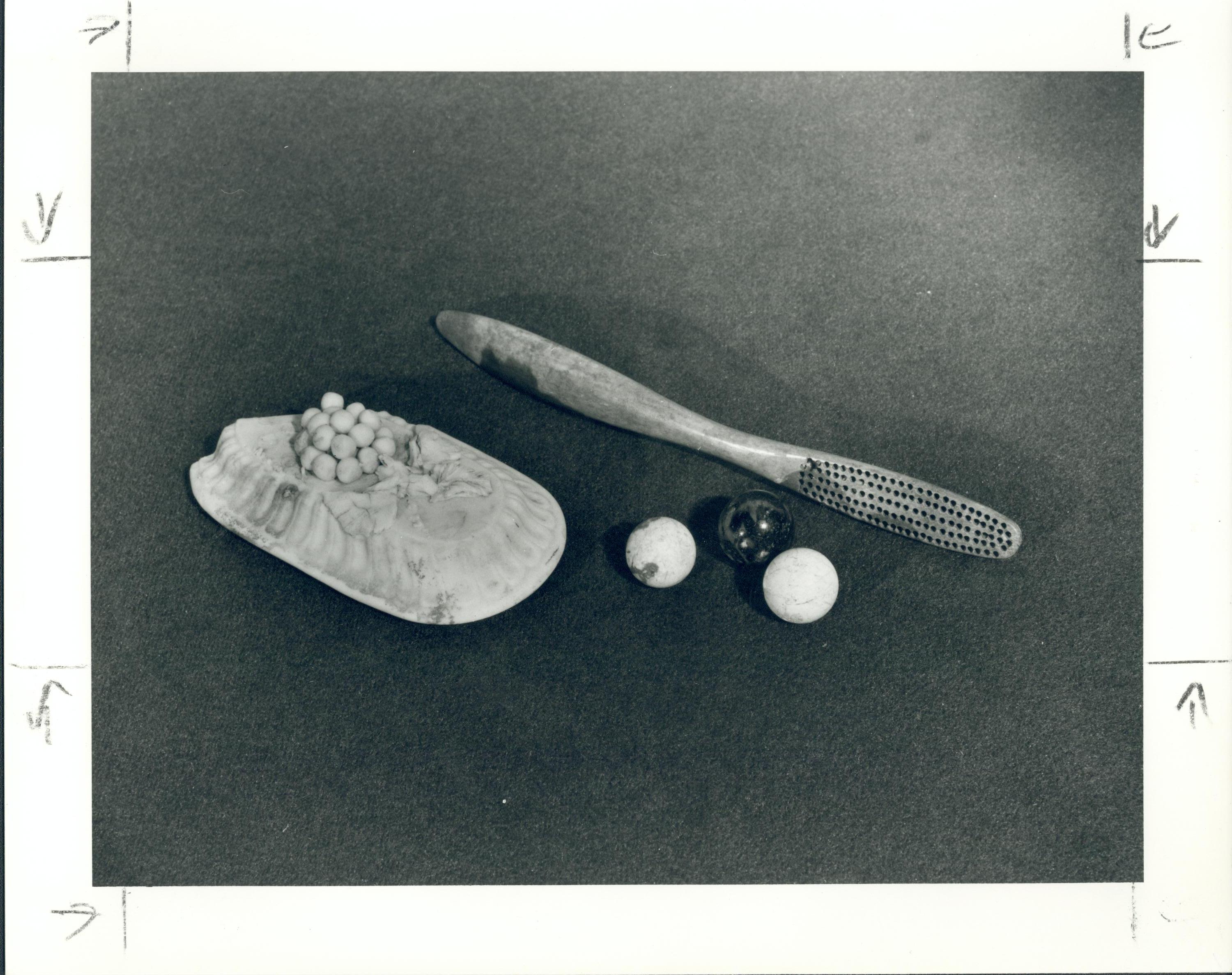 Artifacts found during 1950s Hagen archeology projects: Bone tooth brush handle, alabaster pin box lid, clay and glass marbles