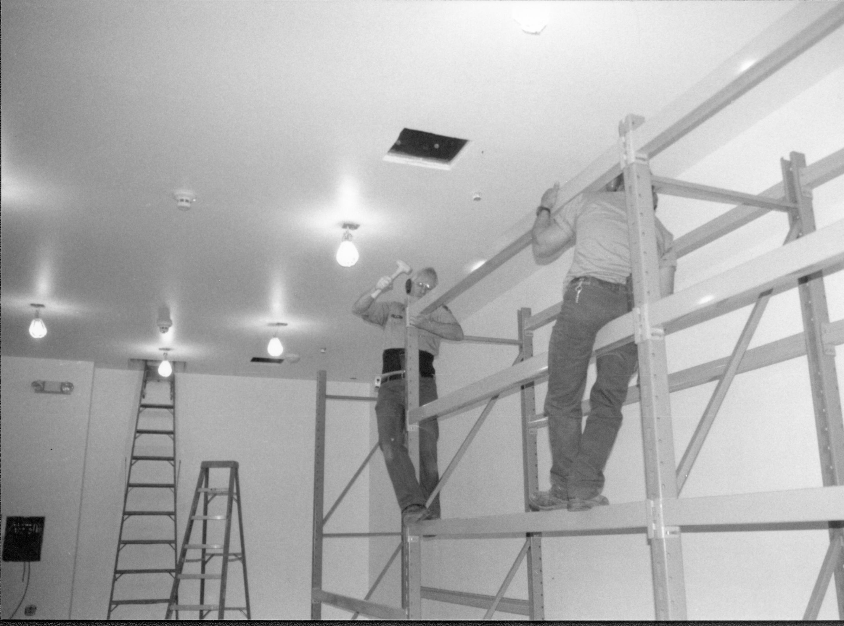 Storage shelves built and installed along the North wall in the Arnold Barn facility Lincoln Home NHS, CRS Collection Move, Arnold Barn, Roll N11, exp 13, sheet 4 of 5 Arnold Barn, move, storage