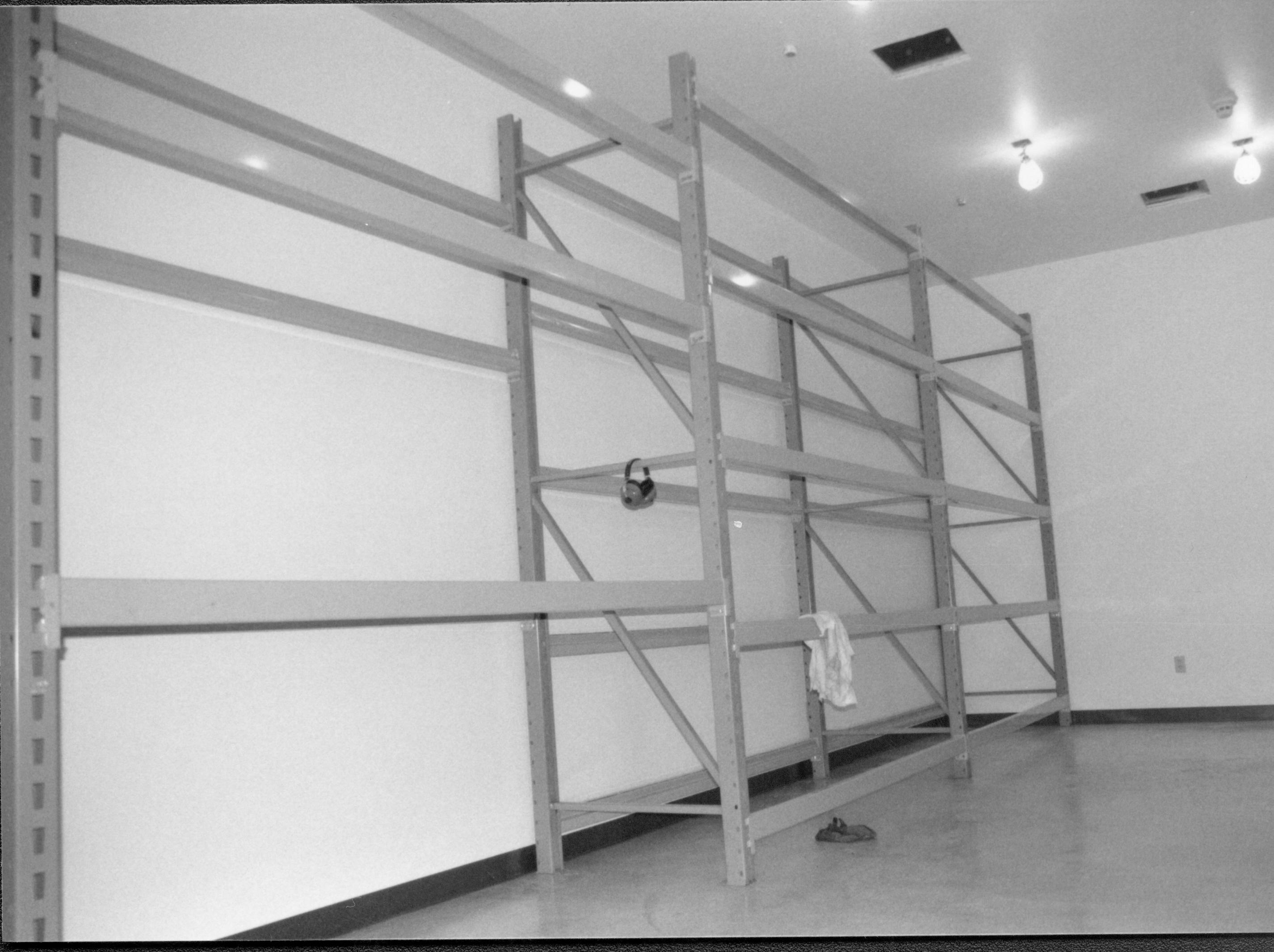 Skeleton for storage shlving completed and installed on North wall Lincoln Home NHS, CRS Collection Move, Arnold Barn, Roll N11, exp 16, sheet 4 of 5 Arnold Barn, move, storage