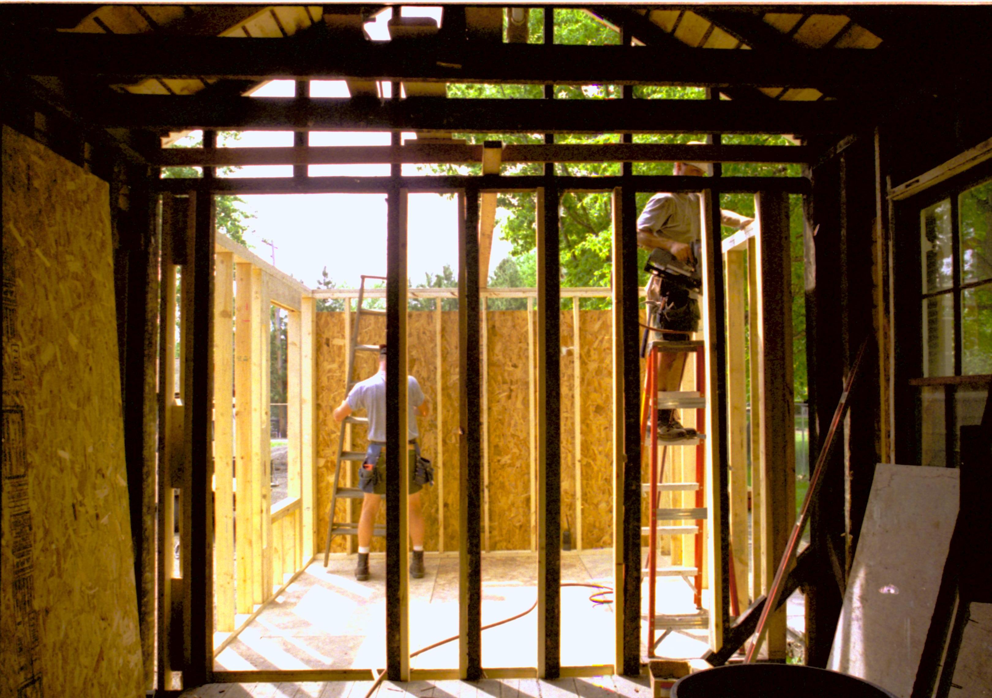 Looking West from Room 104, into room 105 (East wall in forground). Wall studs and plywood in place. Photo taken facing West Lincoln Home NHS, HS-2, CRS Collection Move, Arnold Barn, Room 105, Roll N8, exp 15 Corneau, renovation
