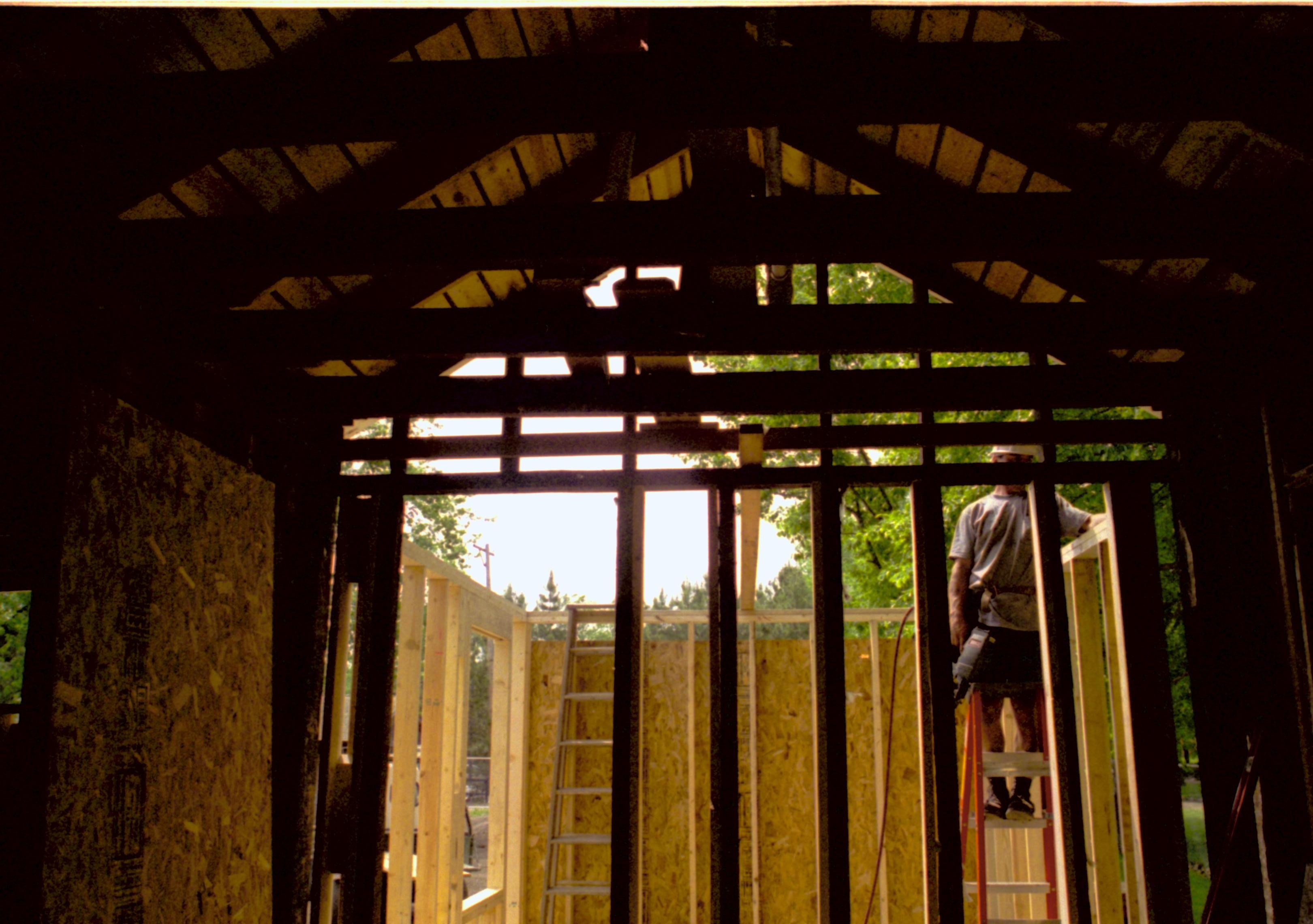 Looking West from Room 104, into room 105 (East wall in forground). Wall studs and plywood in place. Photo taken facing West Lincoln Home NHS, HS-2, CRS Collection Move, Arnold Barn, Room 105, Roll N8, exp 16 Corneau, renovation
