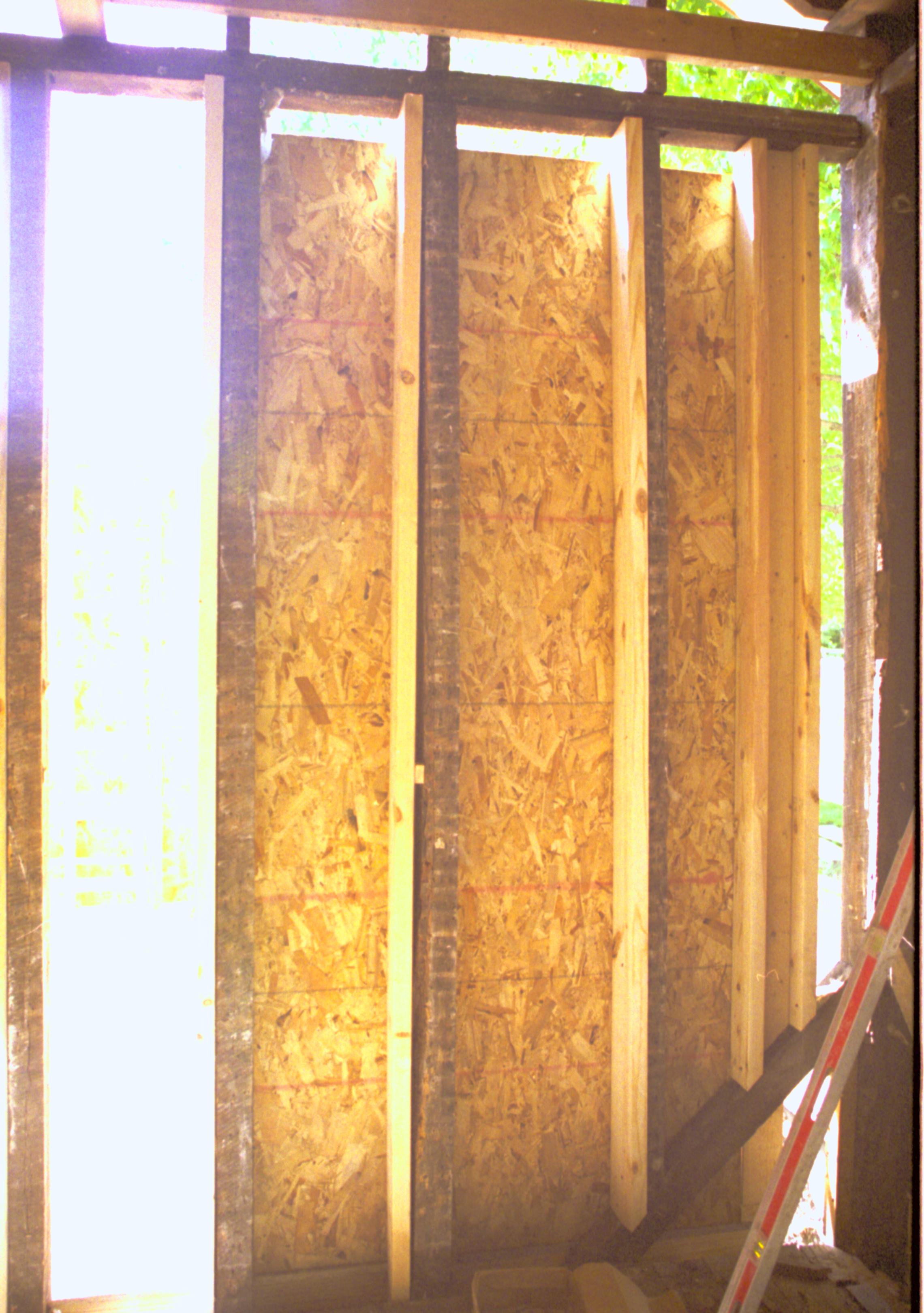 Looking West from Room 104, into room 105 (East wall in forground). Wall studs and plywood in place. Photo taken facing West Lincoln Home NHS, HS-2, CRS Collection Move, Arnold Barn, Room 105, Roll N8, exp 17 Corneau, renovation