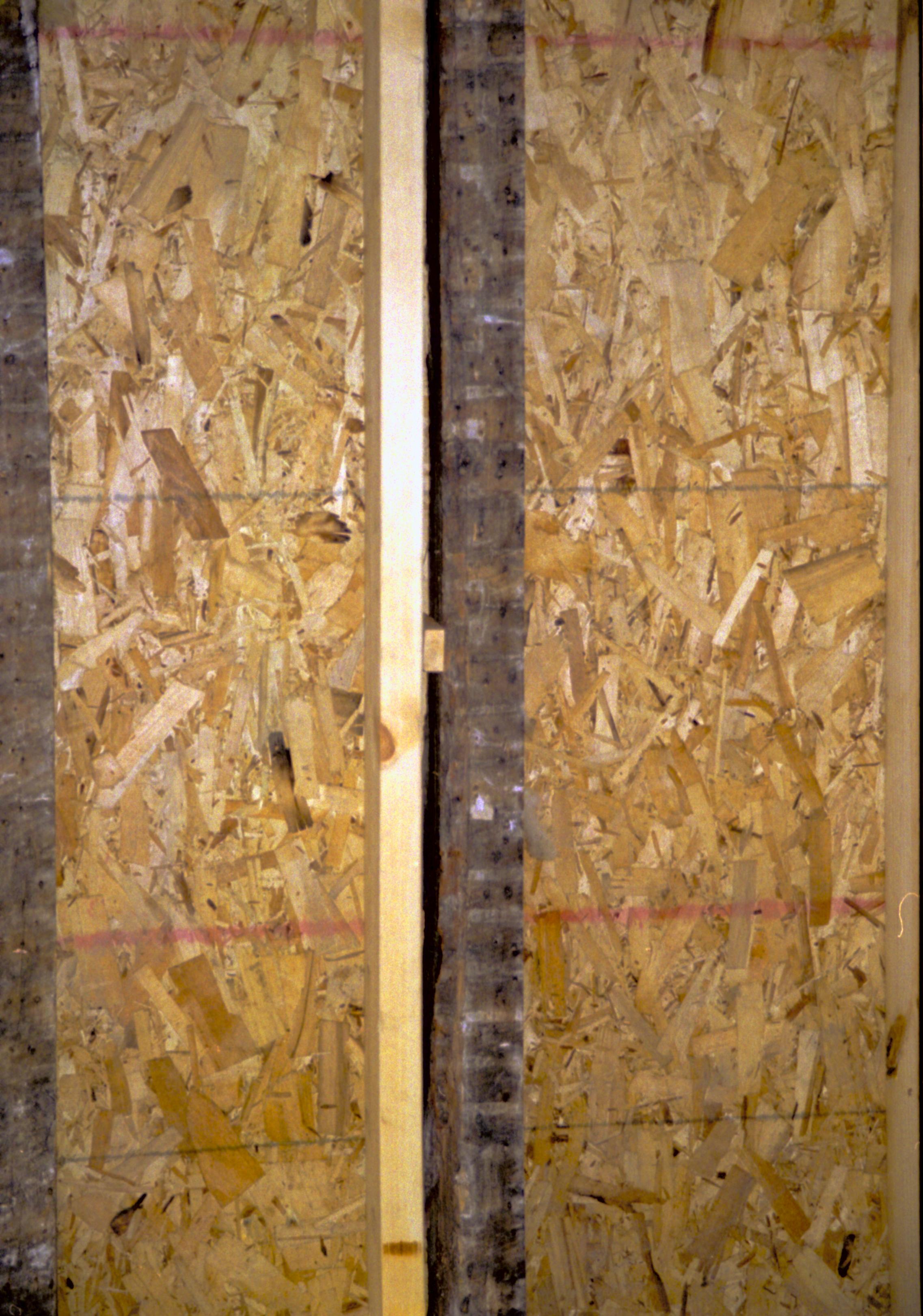 Looking West from Room 104, into room 105 (East wall in forground). Wall studs and plywood in place. Photo taken facing West Lincoln Home NHS, HS-2, CRS Collection Move, Arnold Barn, Room 105, Roll N8, exp 18 Corneau, renovation