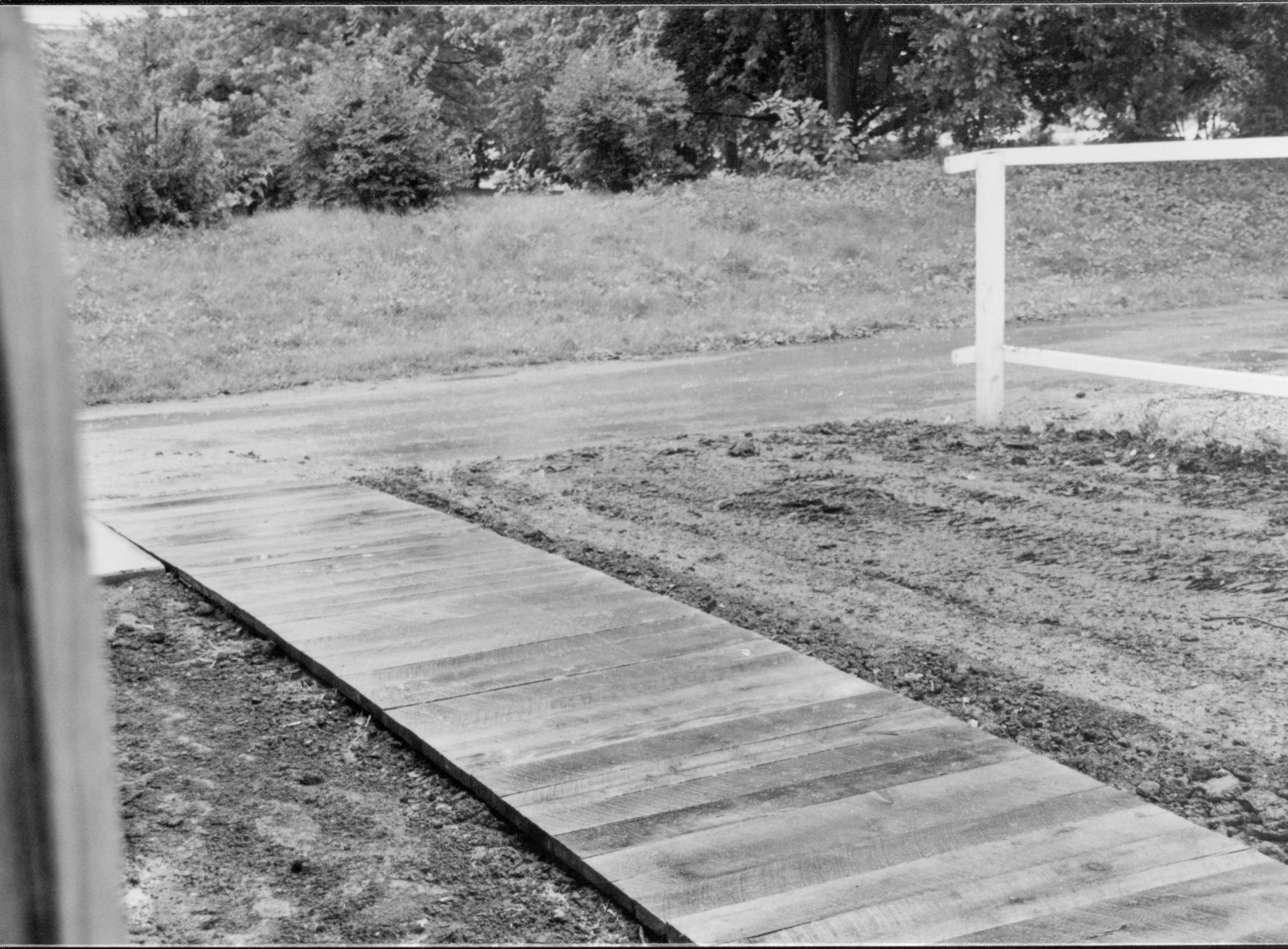 Boardwalk leading from alley to door of facility Lincoln Home NHS, CRS Collection Move, Facing alley at East, Roll N10, exp 2 sheet 1 of 7 Arnold Barn, renovation