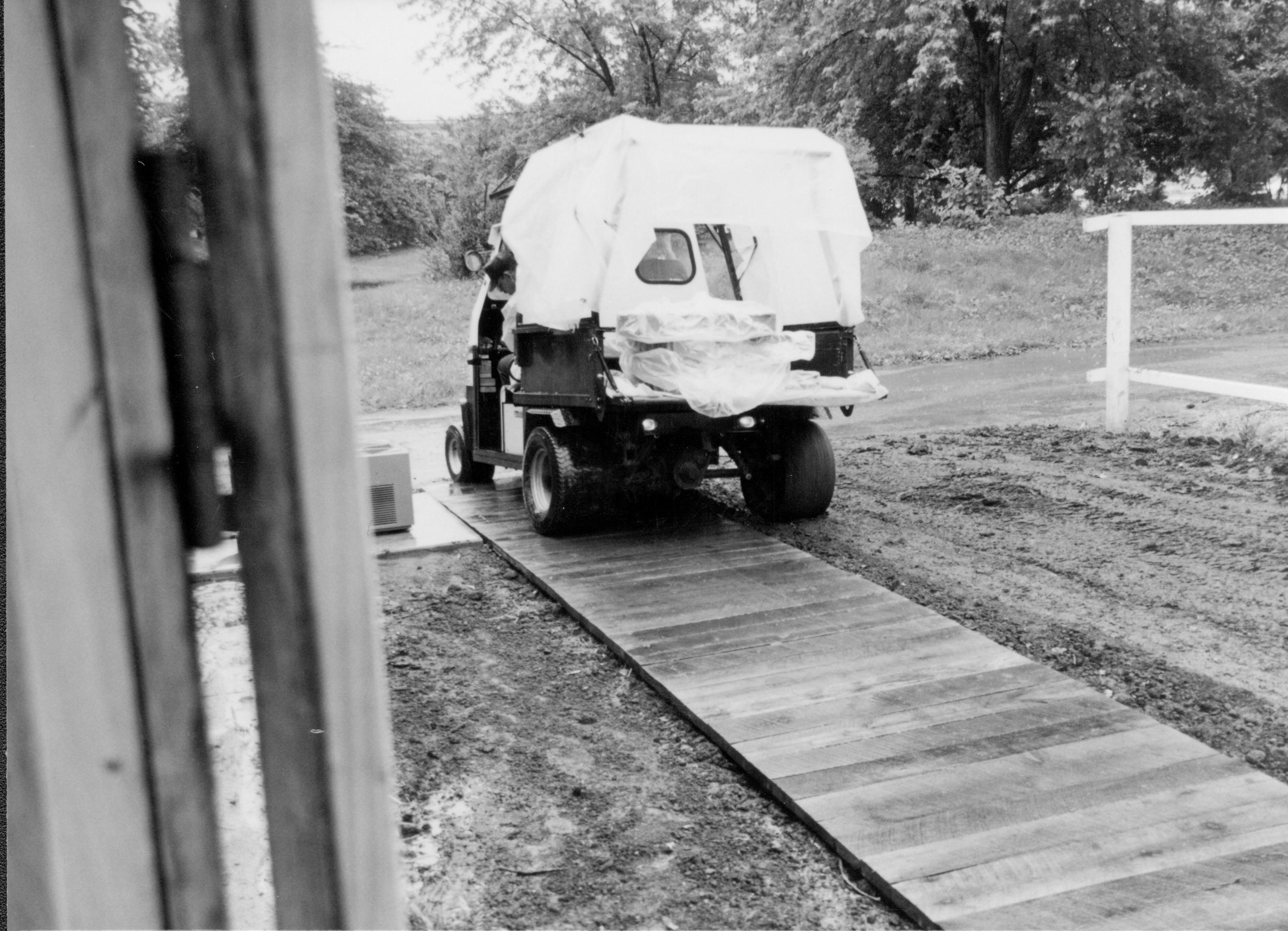 Artifacts in transit from old to new storage facilities Lincoln Home NHS, CRS Collection Move, Facing alley at East, Roll N10, exp 3 sheet 1 of 7 Arnold Barn, renovation