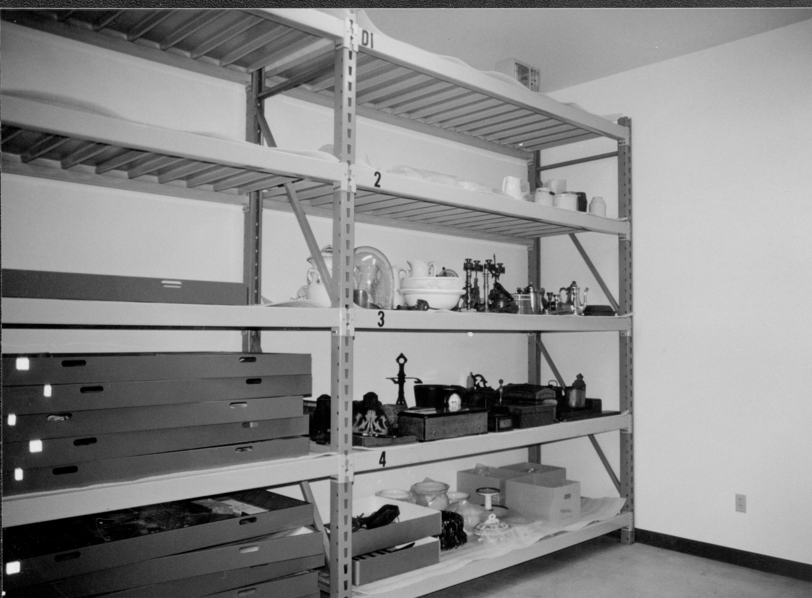 North wall storage shelves with artifacts Lincoln Home NHS, CRS Collection Move, Facing Northeast corner, Roll N10, exp 6 sheet 2 of 7 Arnold Barn, storage, artifacts