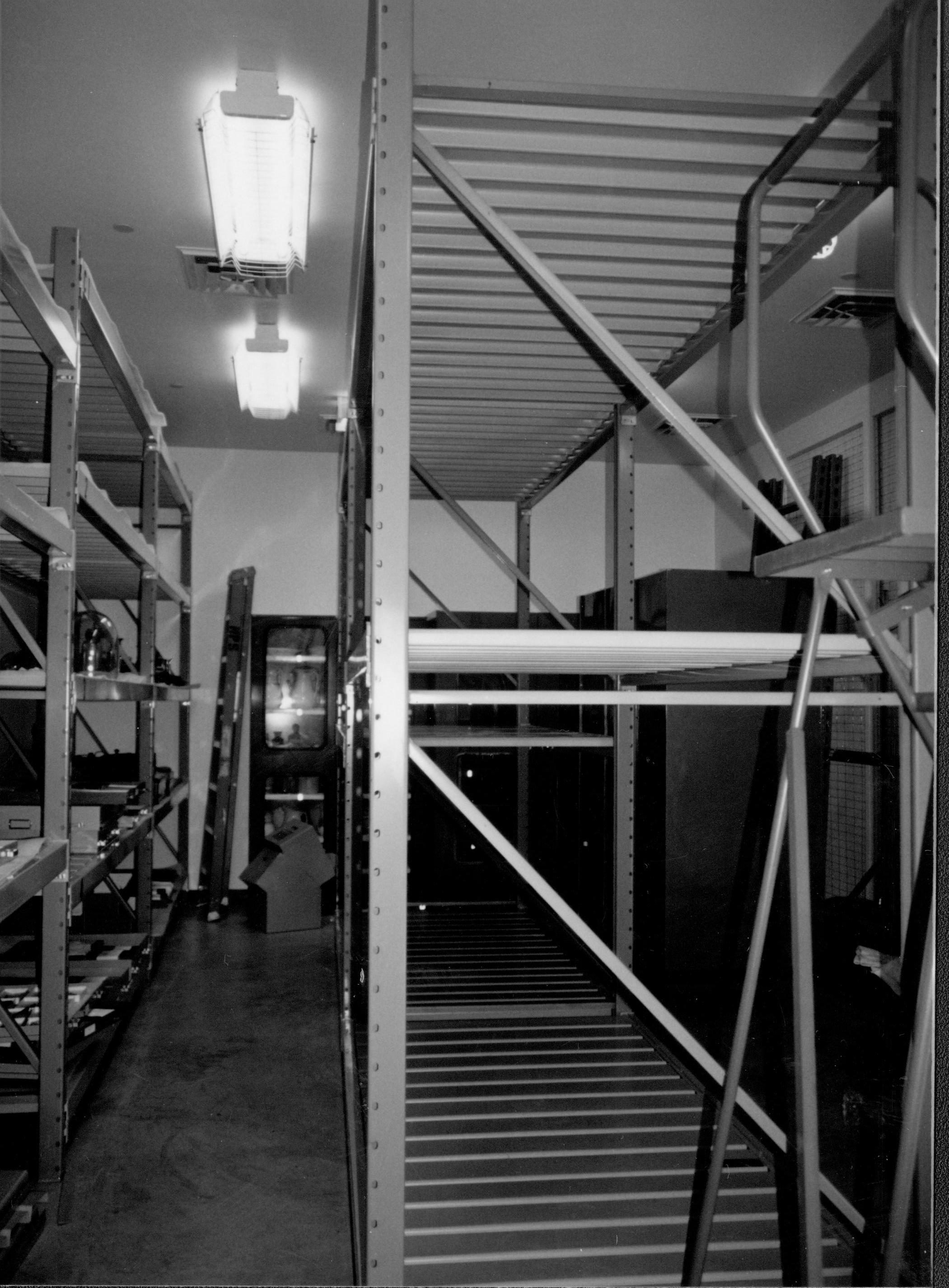 View down North aisle during installation of artifacts; facing East wall Lincoln Home NHS, CRS Collection Move, Facing East Wall, Roll N10, exp 12 sheet 3 of 7 Arnold Barn, storage, artifacts