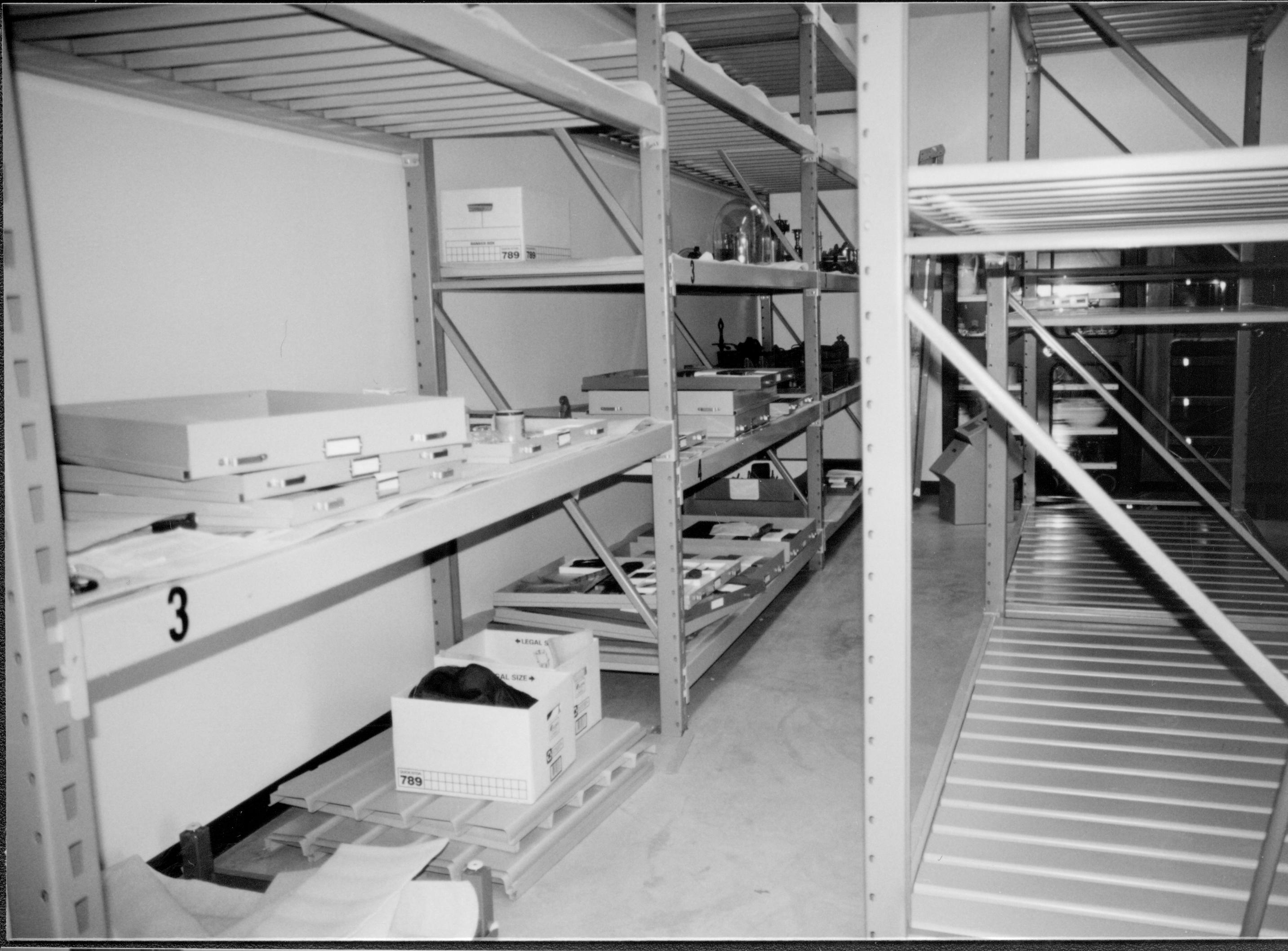 View down North aisle during installation of artifacts; facing Northeast wall Lincoln Home NHS, CRS Collection Move, Facing East Wall, Roll N10, exp 13 sheet 4 of 7 Arnold Barn, storage, artifacts